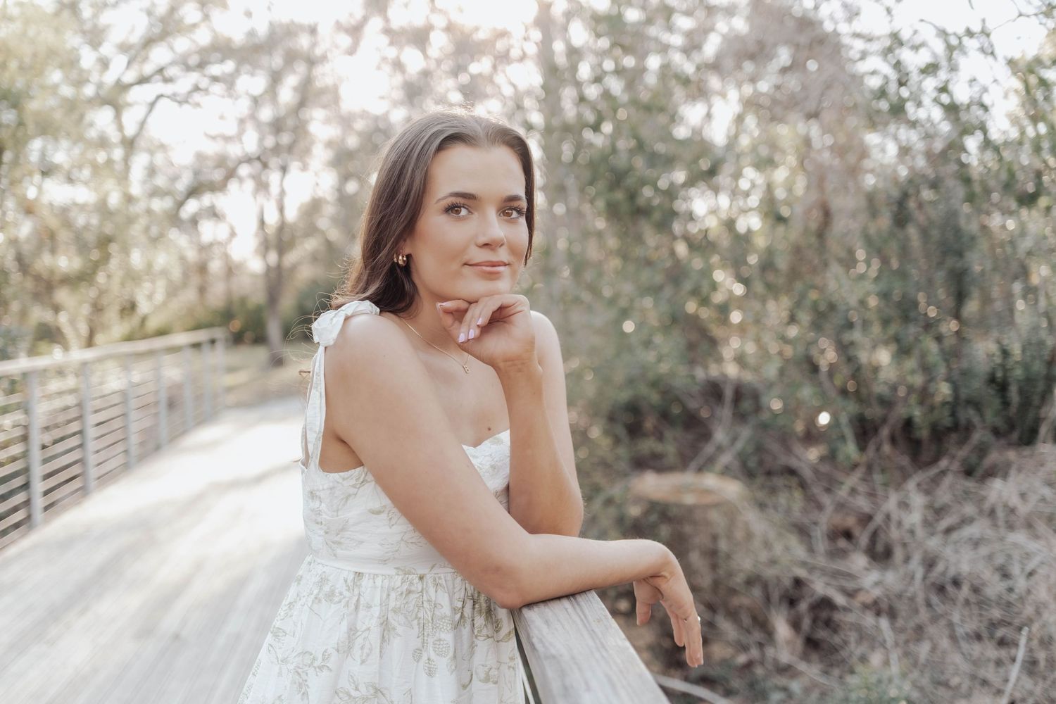 Senior portraits at LSU Hilltop Arboretum with natural light, greenery, and timeless style—capturing authentic moments in a serene setting.