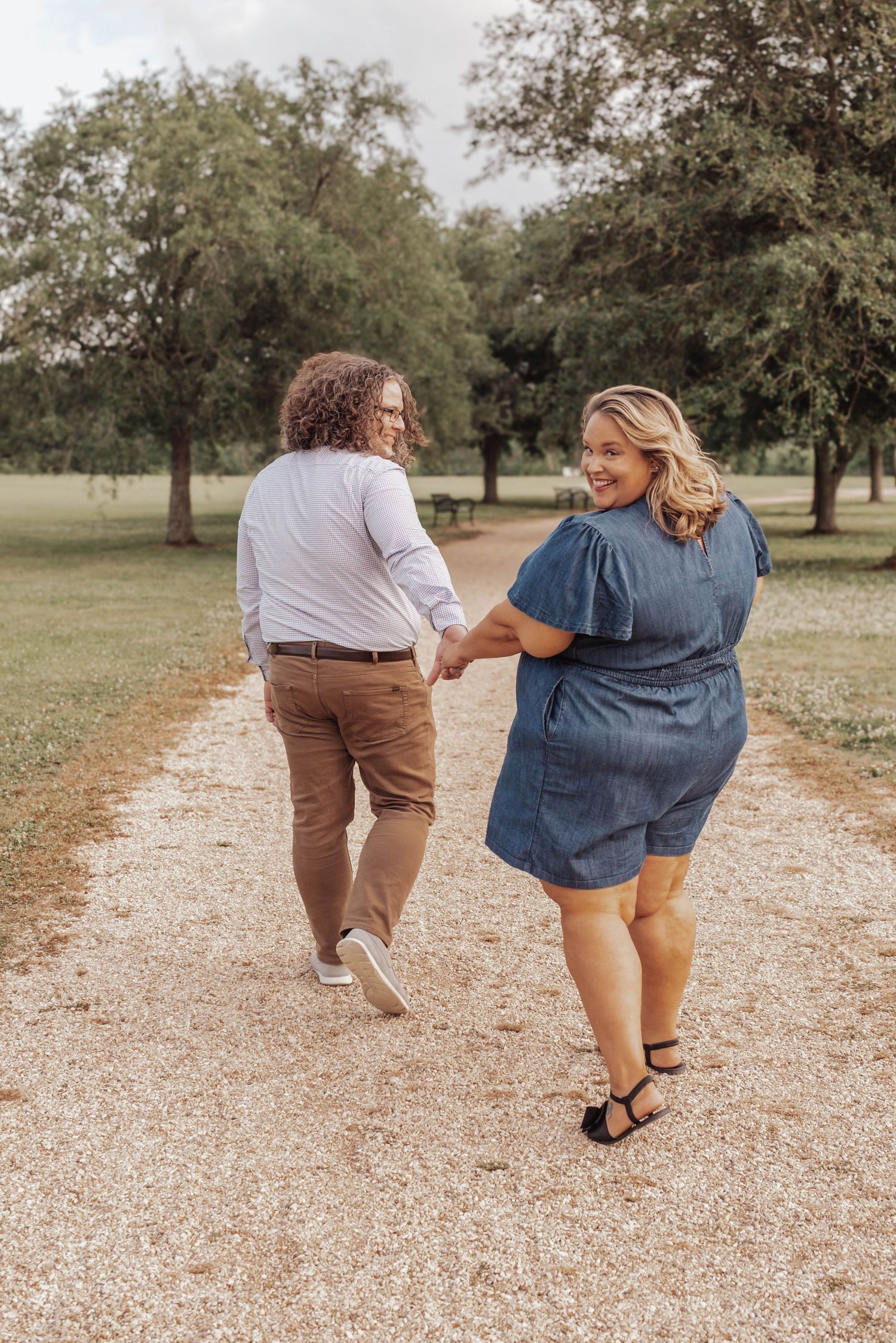 Romantic couple’s portrait at Highland Park in Baton Rouge—natural light, lush greenery, and authentic moments captured with timeless style.