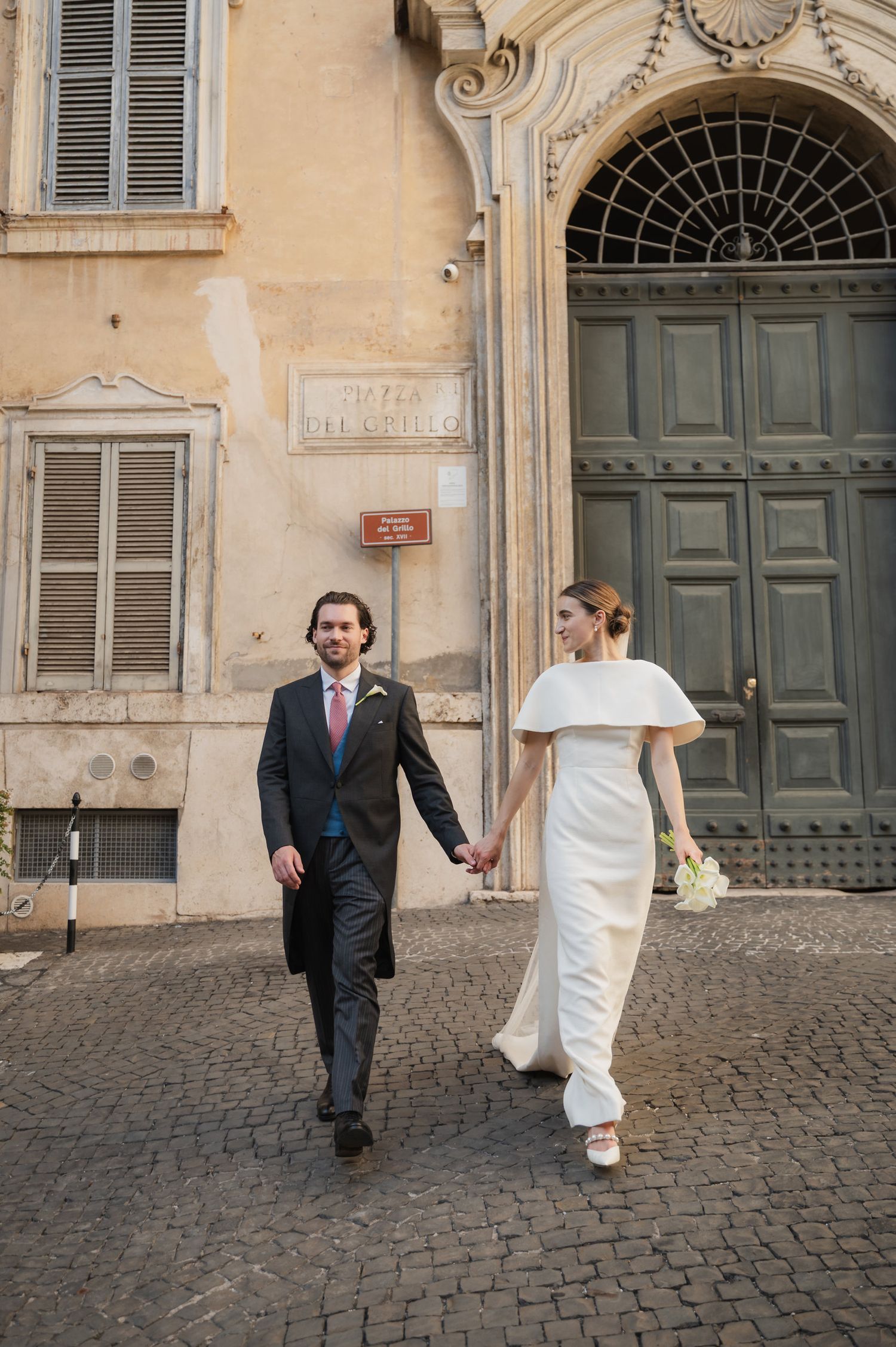 Candid sequence of newlyweds walking and laughing on European cobblestone street.