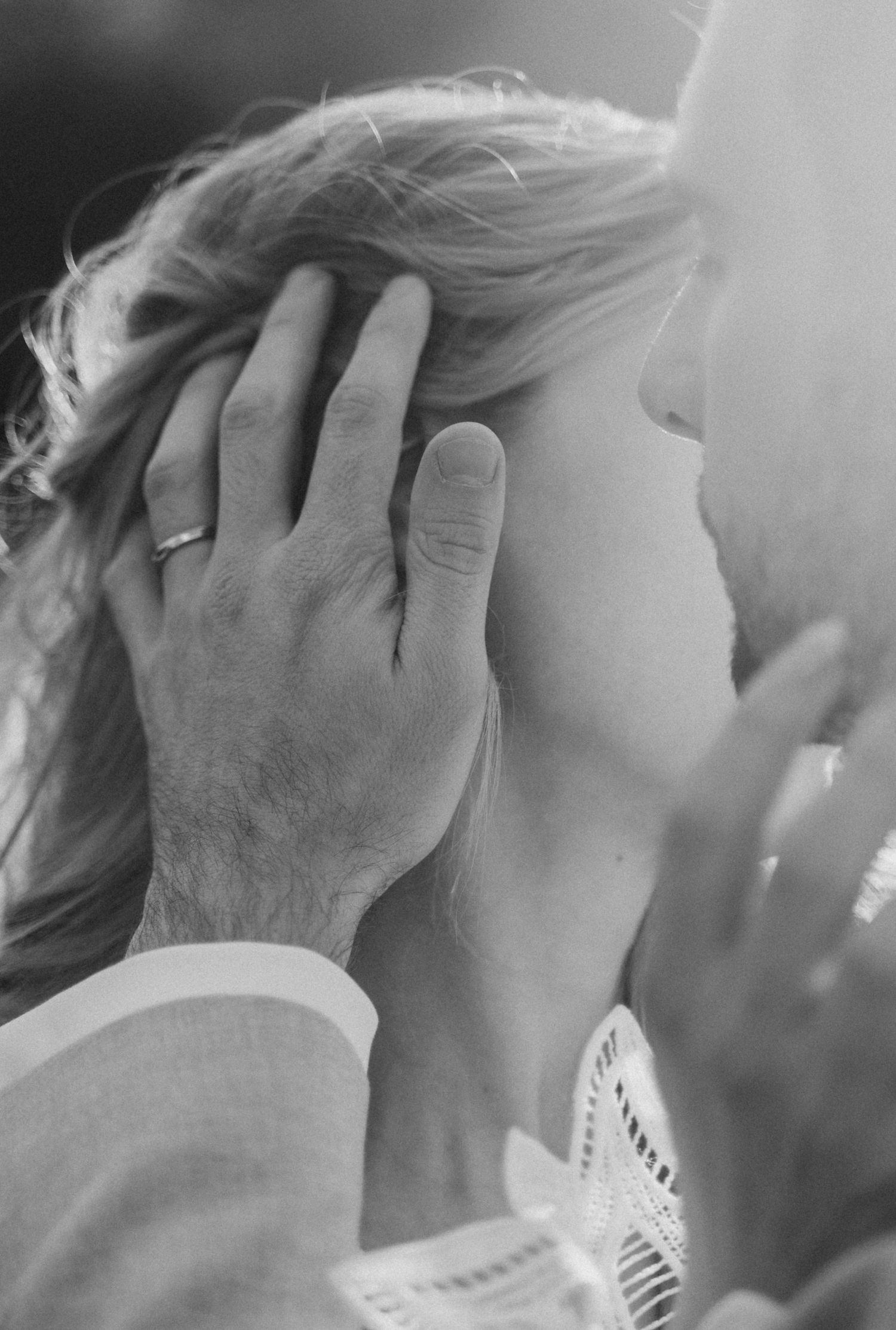 A black and white artistic photo series showing emotional moments with hands covering faces.