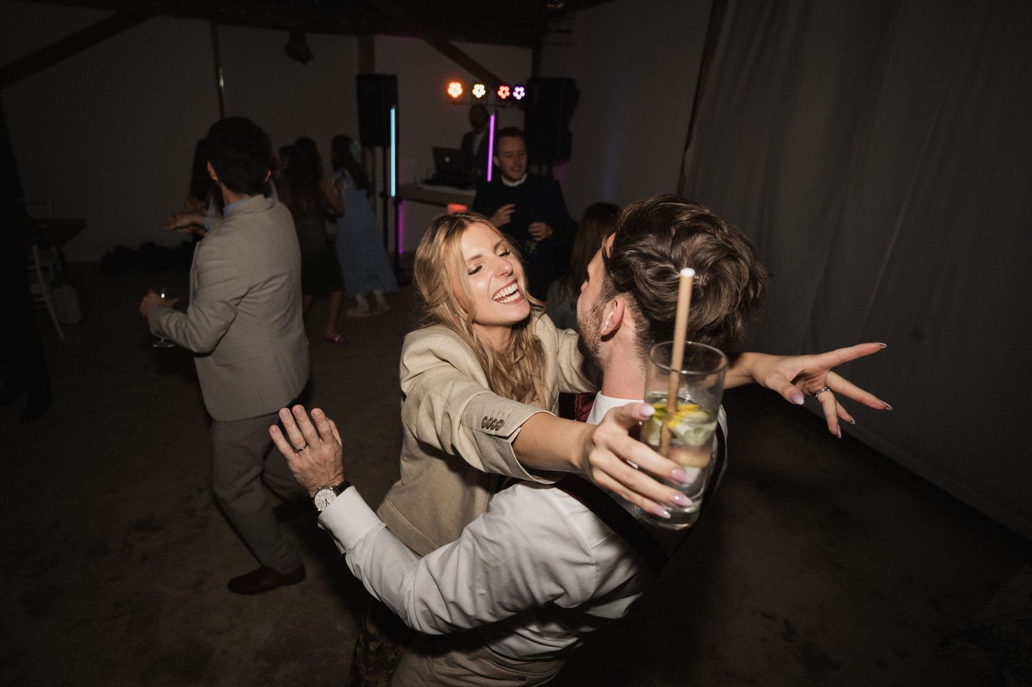 A series of dark, dimly lit photos showing people dancing and socializing at what appears to be a nightclub or party.