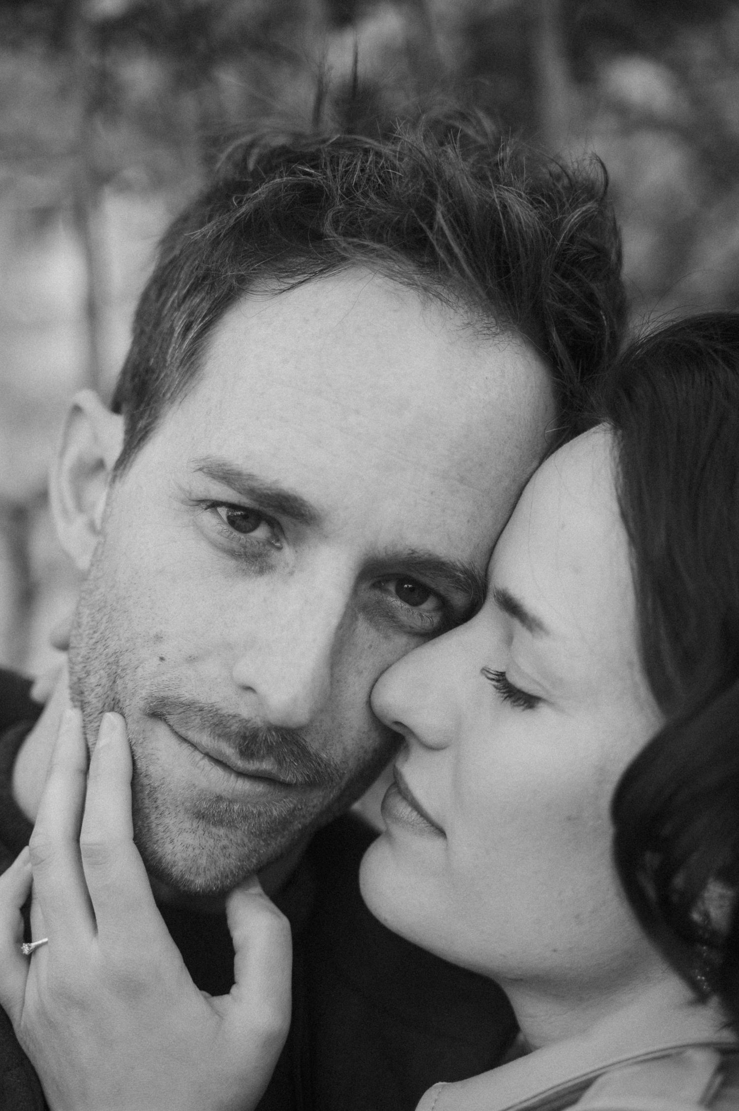 A romantic black and white photo series showing tender moments between two people.