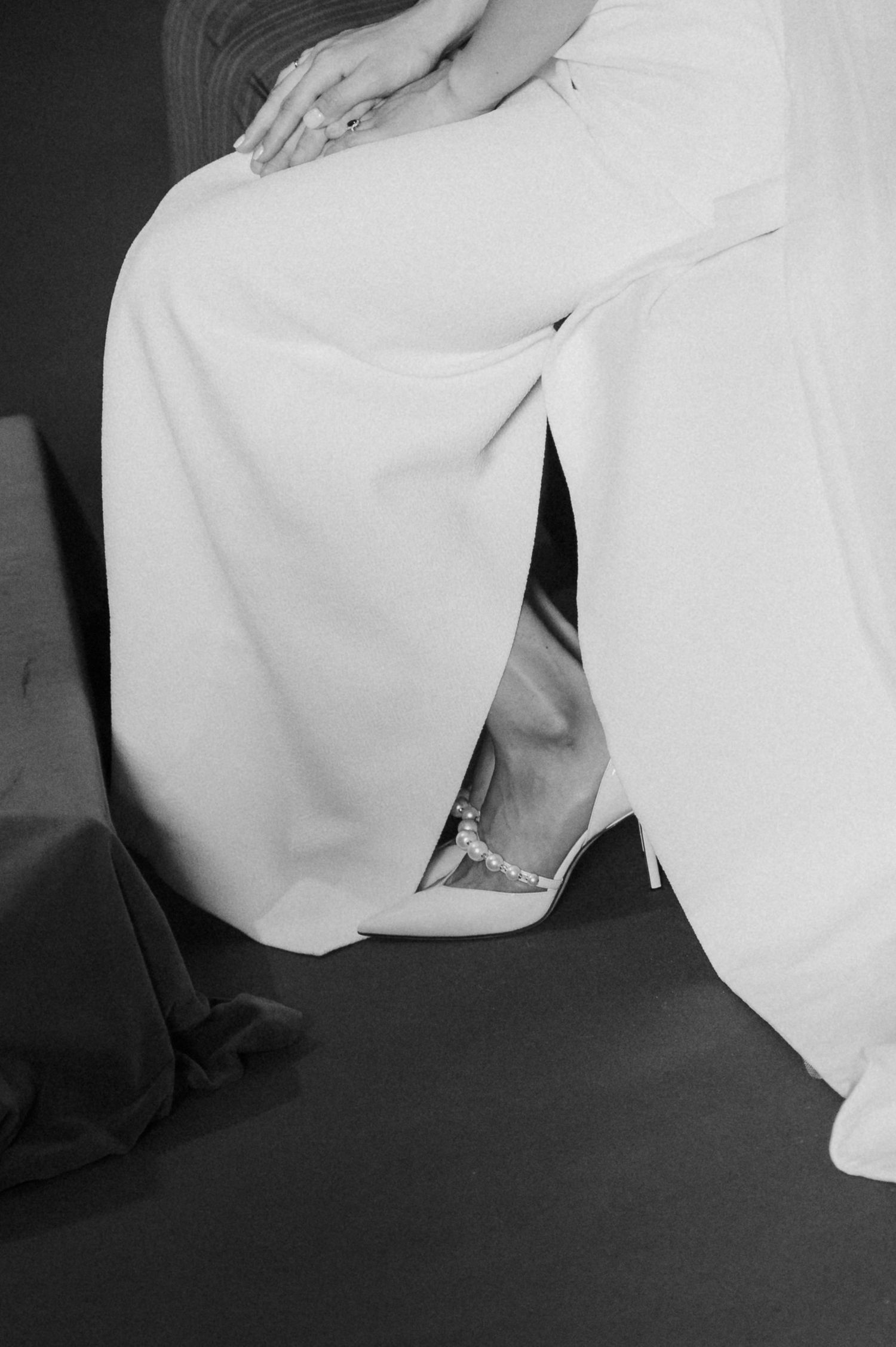 Abstract black and white close-up details of flowing white wedding dress fabric.