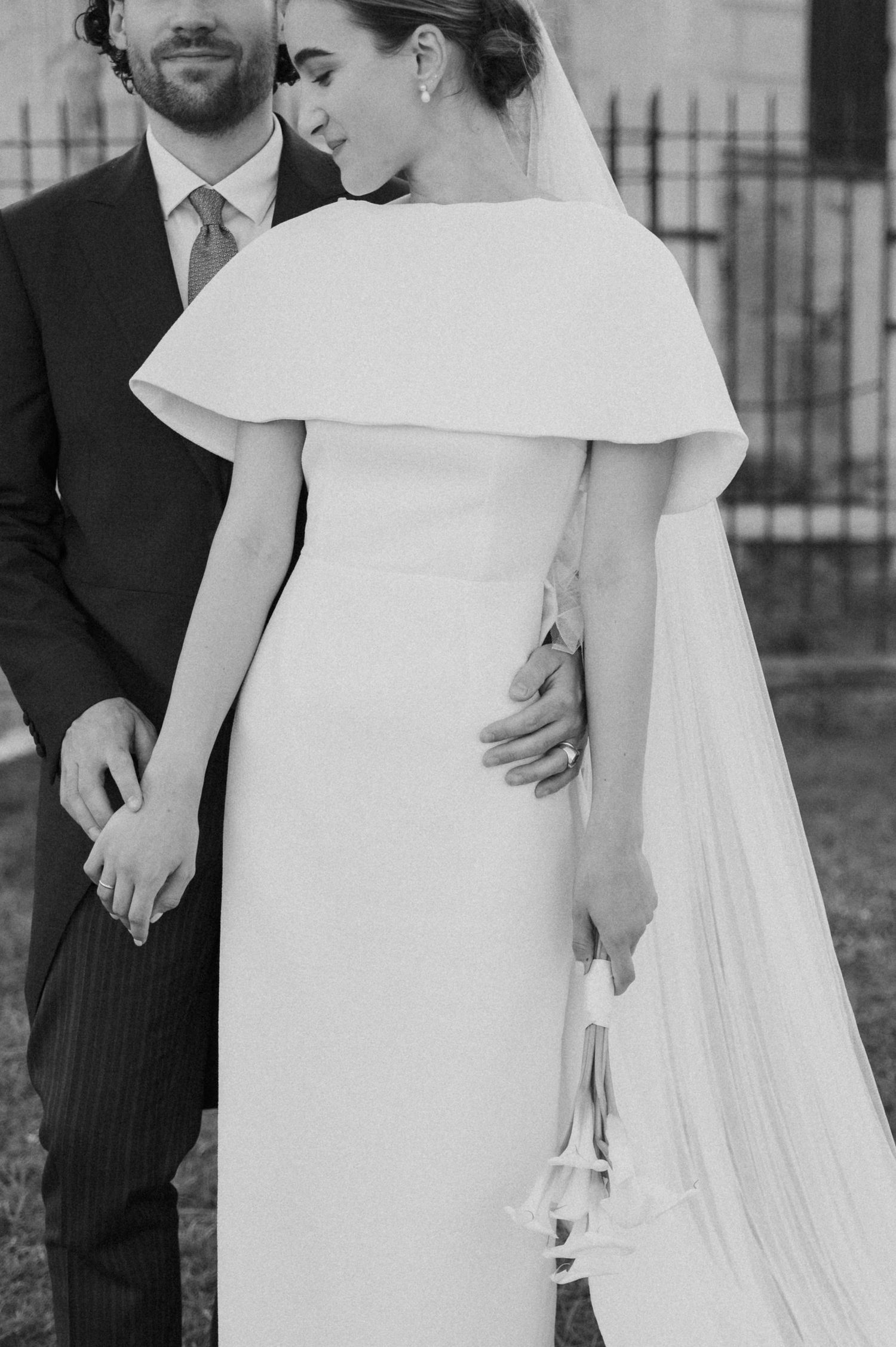 Black and white wedding portraits showing elegant dress details and intimate moments.