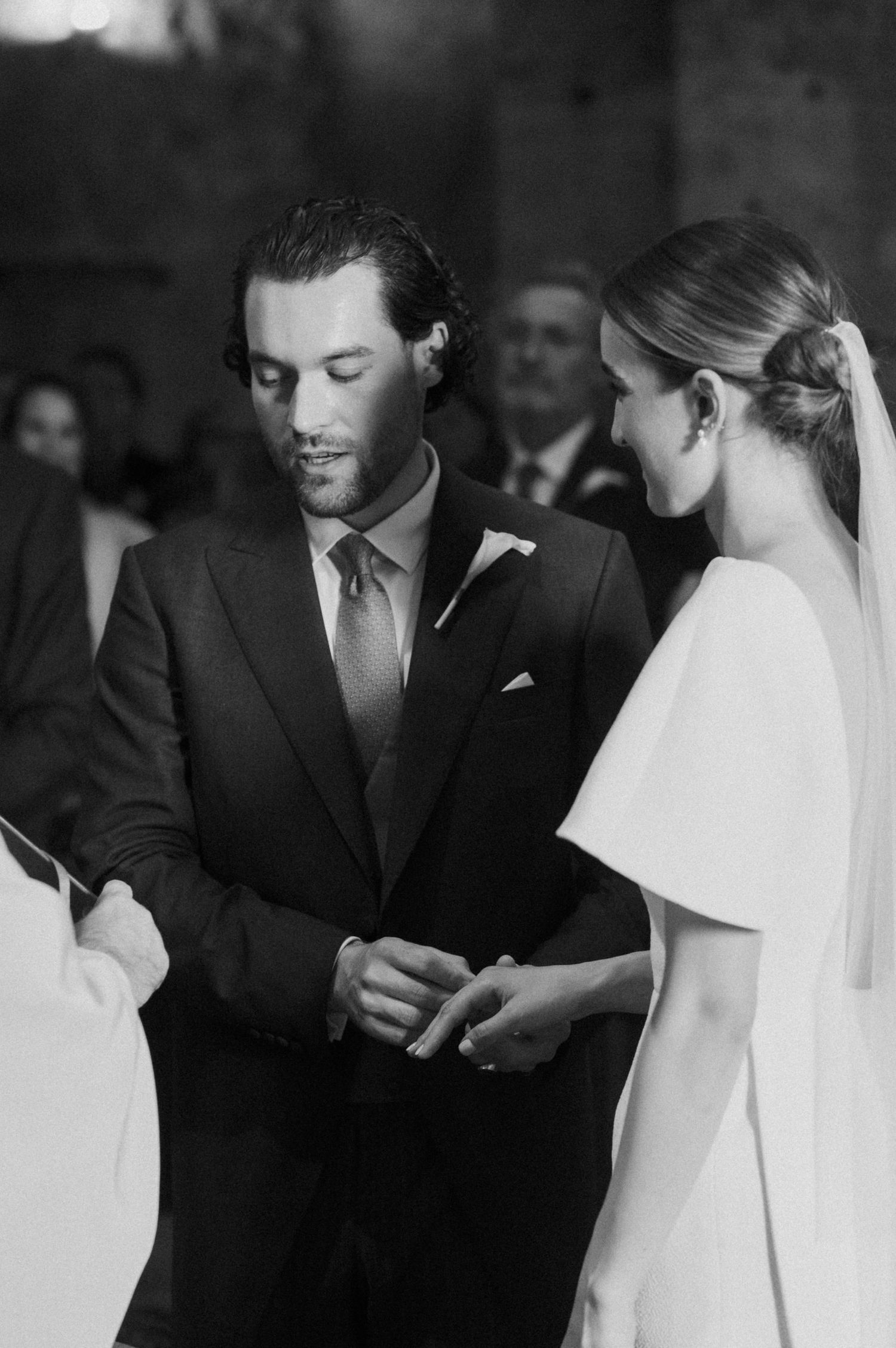 Black and white candid moments from a formal church wedding ceremony.