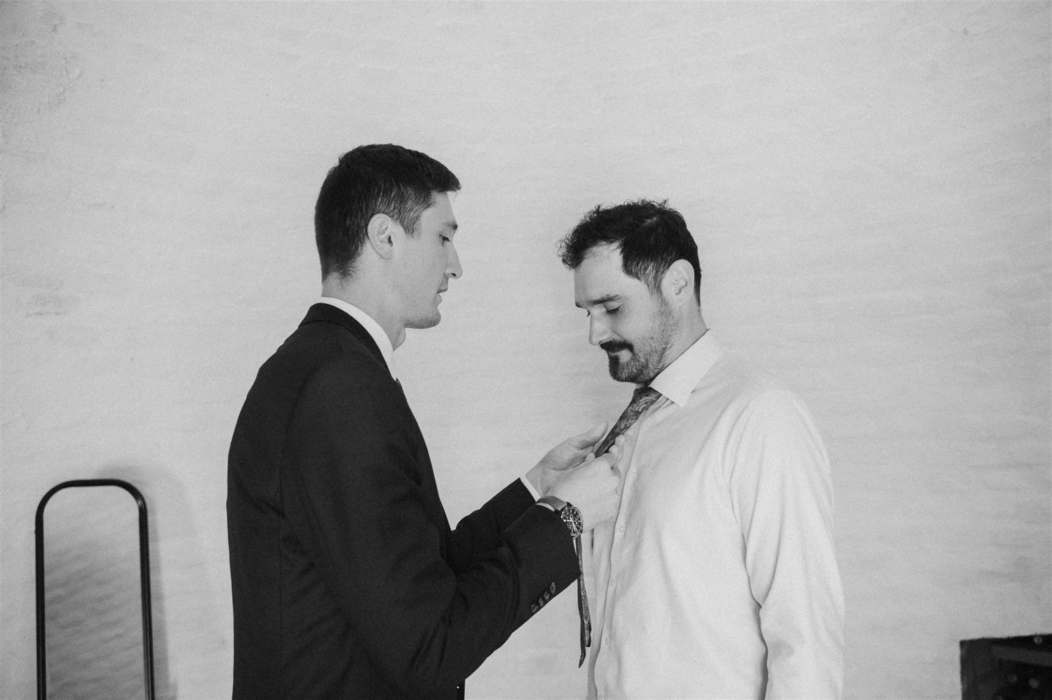 Black and white portrait series showing intimate moments between couple.