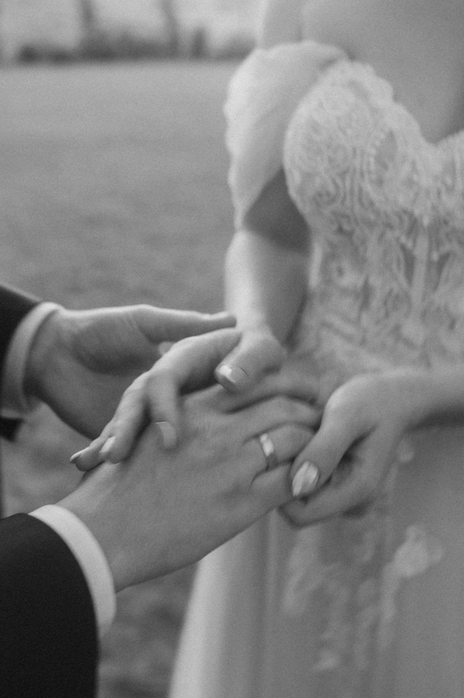 Black and white close-up shots of hands with delicate lace details.