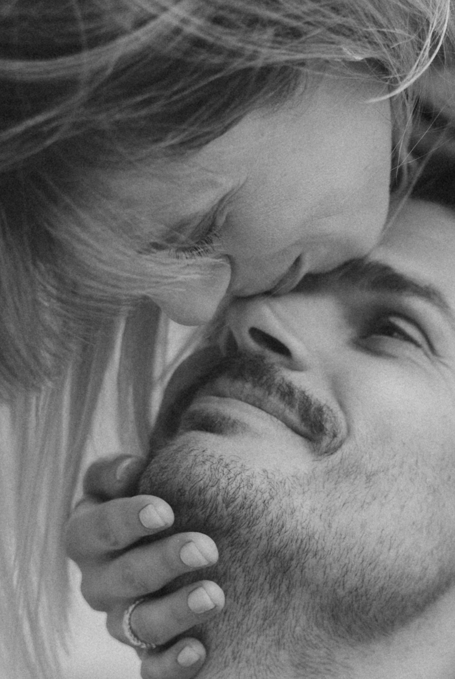 A series of black and white close-up photos showing someone sleeping peacefully with tousled hair and facial stubble.