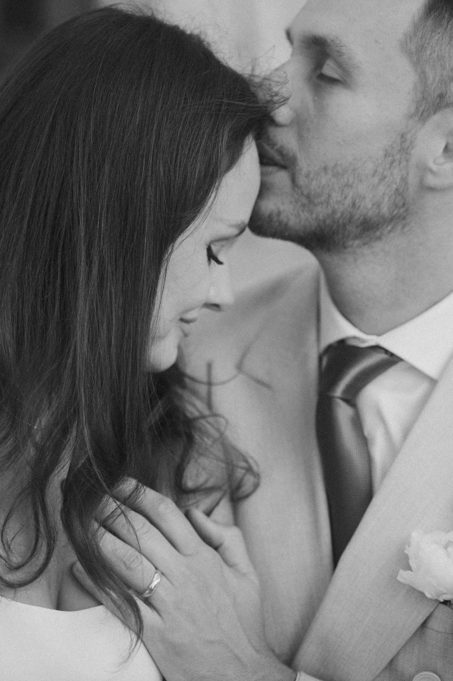 Black and white close-up series of romantic wedding moments.