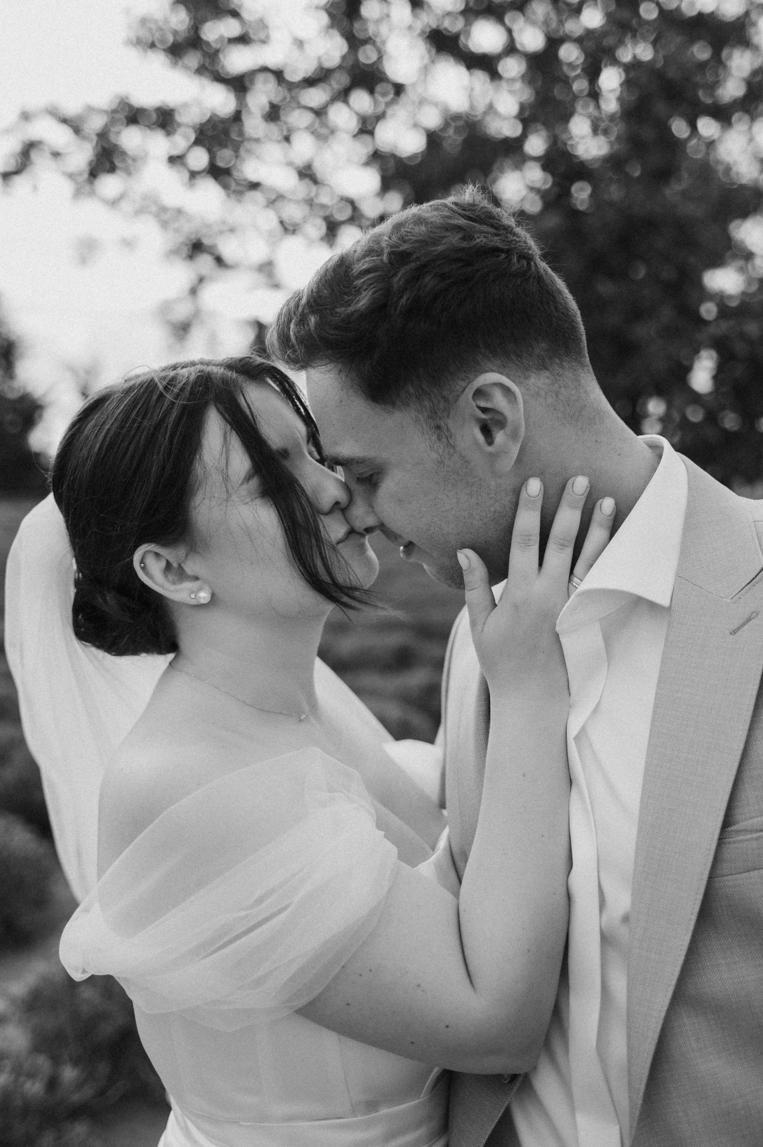 Intimate black and white photo sequence of a romantic moment between newlyweds.