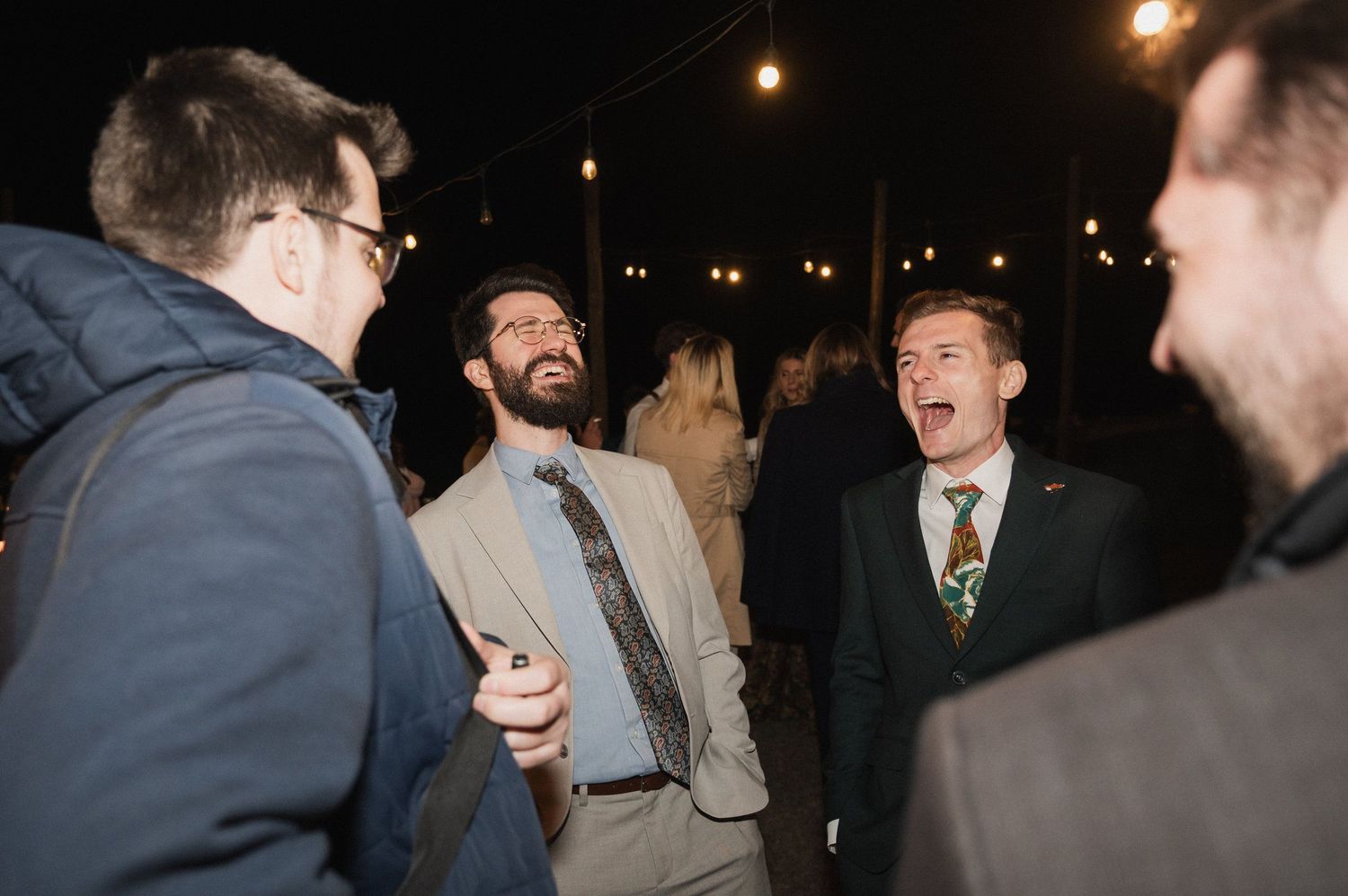 A series of candid reception photos showing guests dancing and socializing at a dimly lit evening celebration.