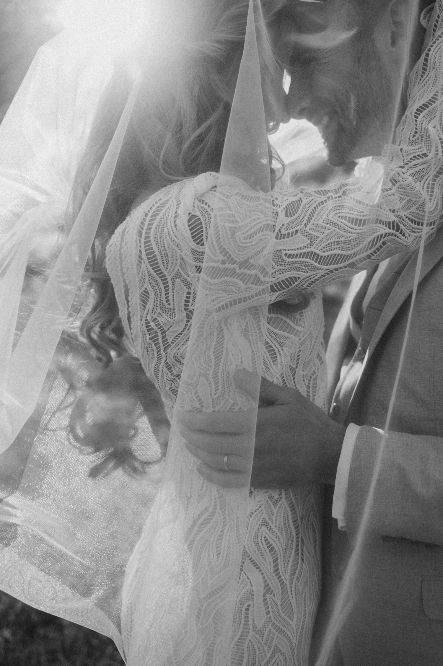 Multiple black and white photographs showing someone in a detailed lace dress with intricate patterns.