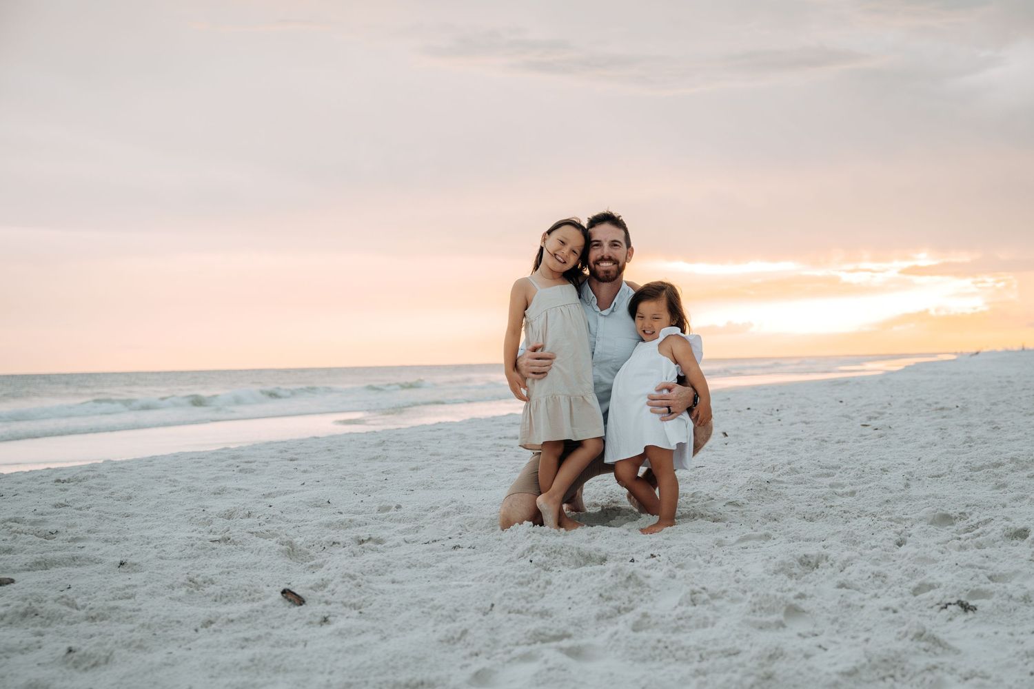 Casual beach family portrait session during golden hour.