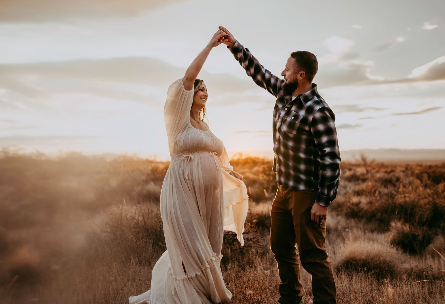 Pregnancy photography session at sunset in Fate TX, flowing dress and the perfect tones.
