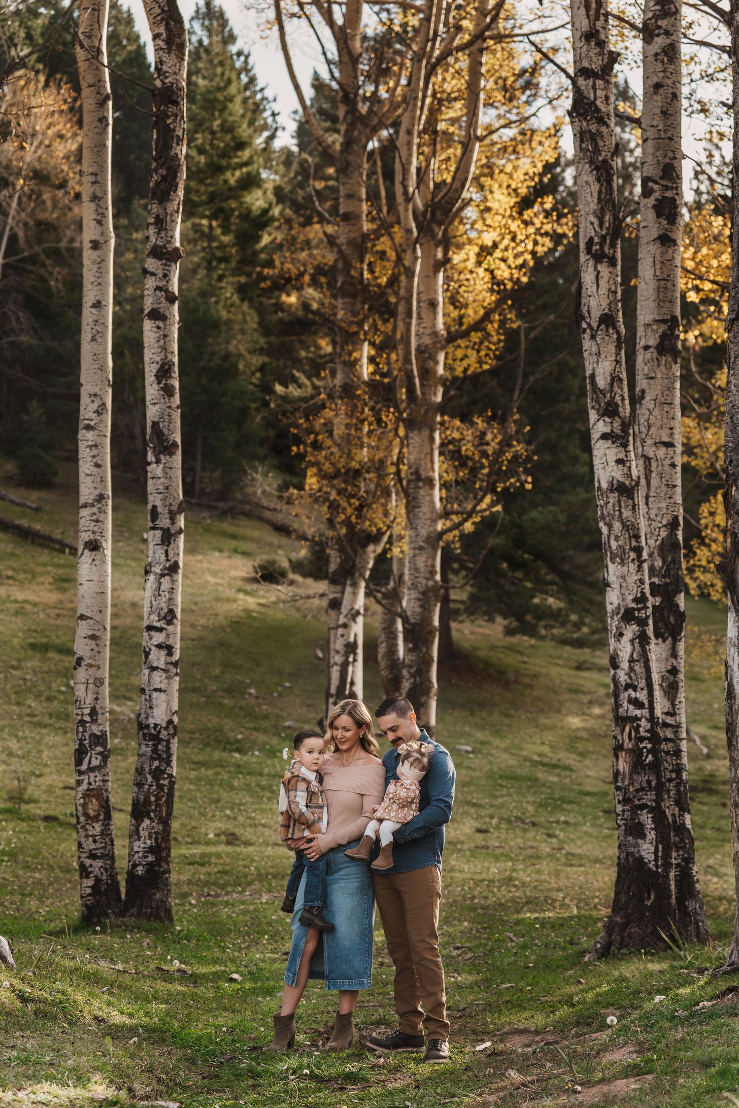Candid family moment with parents talking and children giggling