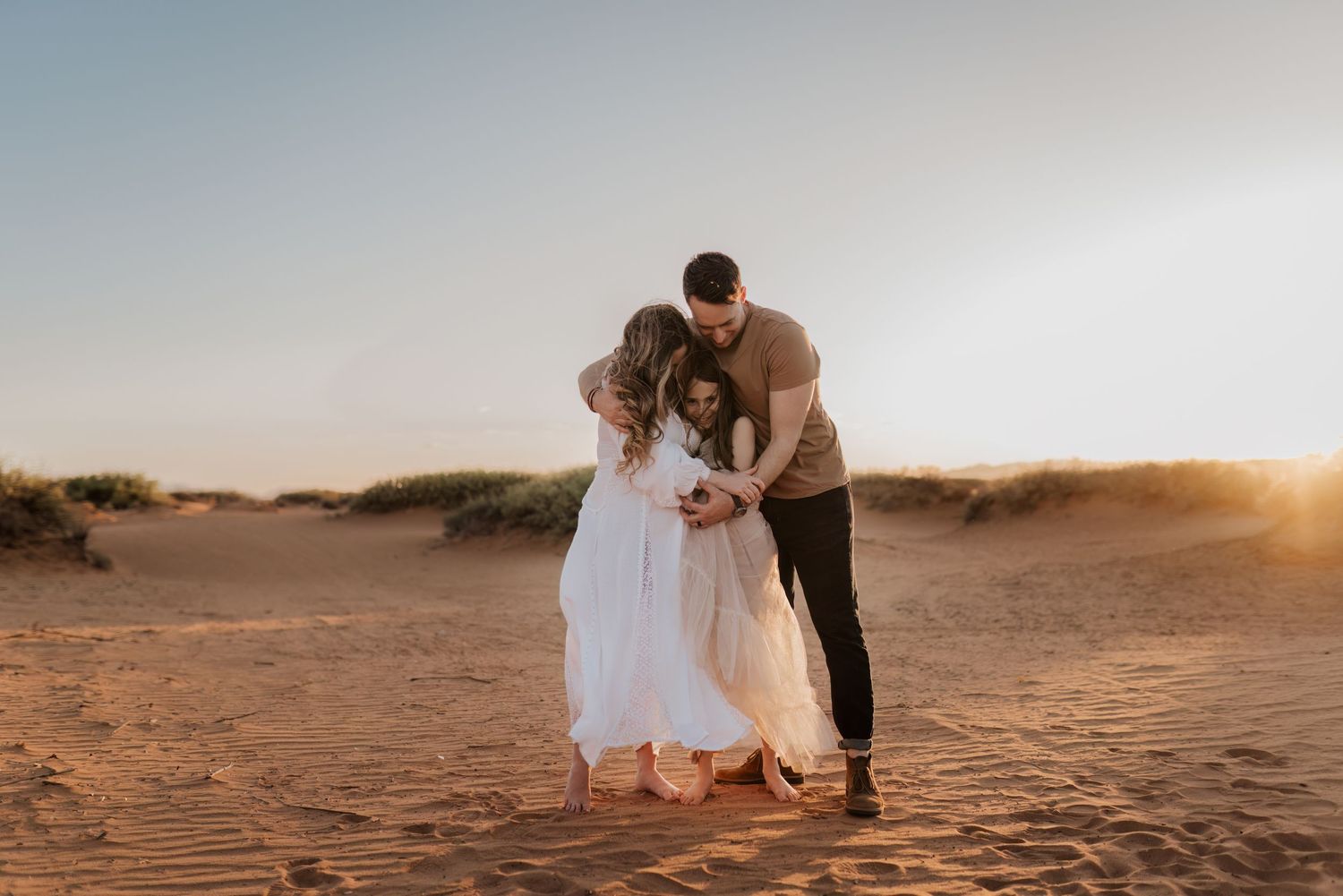 Pregnancy photography session at sunset in El Paso, TX, flowing dress and the perfect tones.
