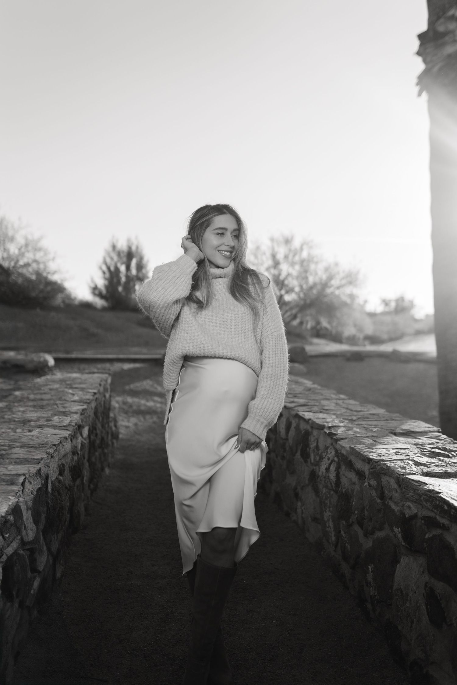 Pregnancy photography session at sunset in Fate TX, flowing dress and the perfect tones.