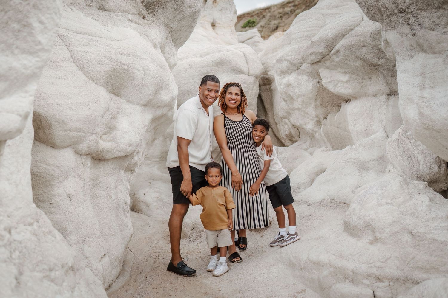 Family photography candid moment with parents and children smiling together in Colorado Springs, ColoradoRockwall, Greenville, Royse City, D