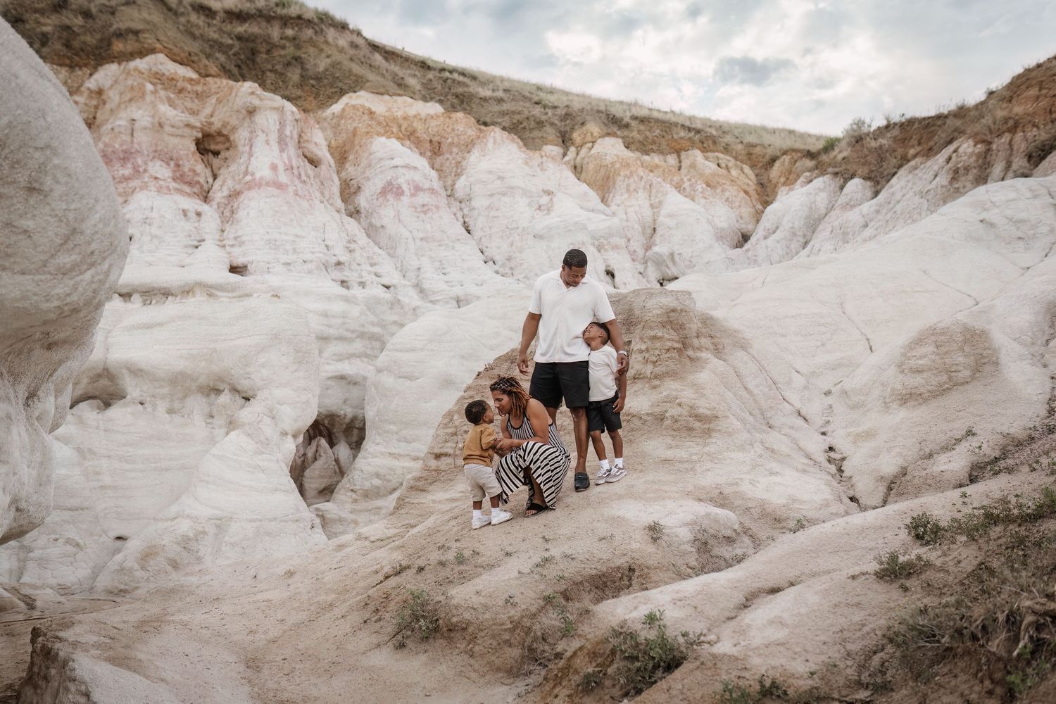 Family photography candid moment with parents and children smiling together in Colorado Springs, ColoradoRockwall, Greenville, Royse City, D