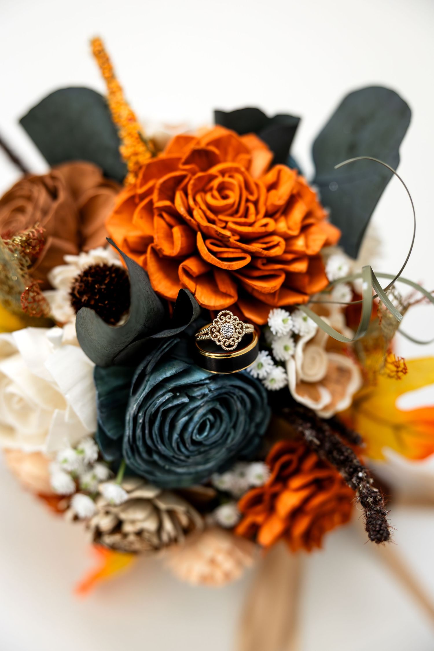 Wedding detail photo highlighting bride and groom wedding rings and bridal bouquet for Missouri Wedding