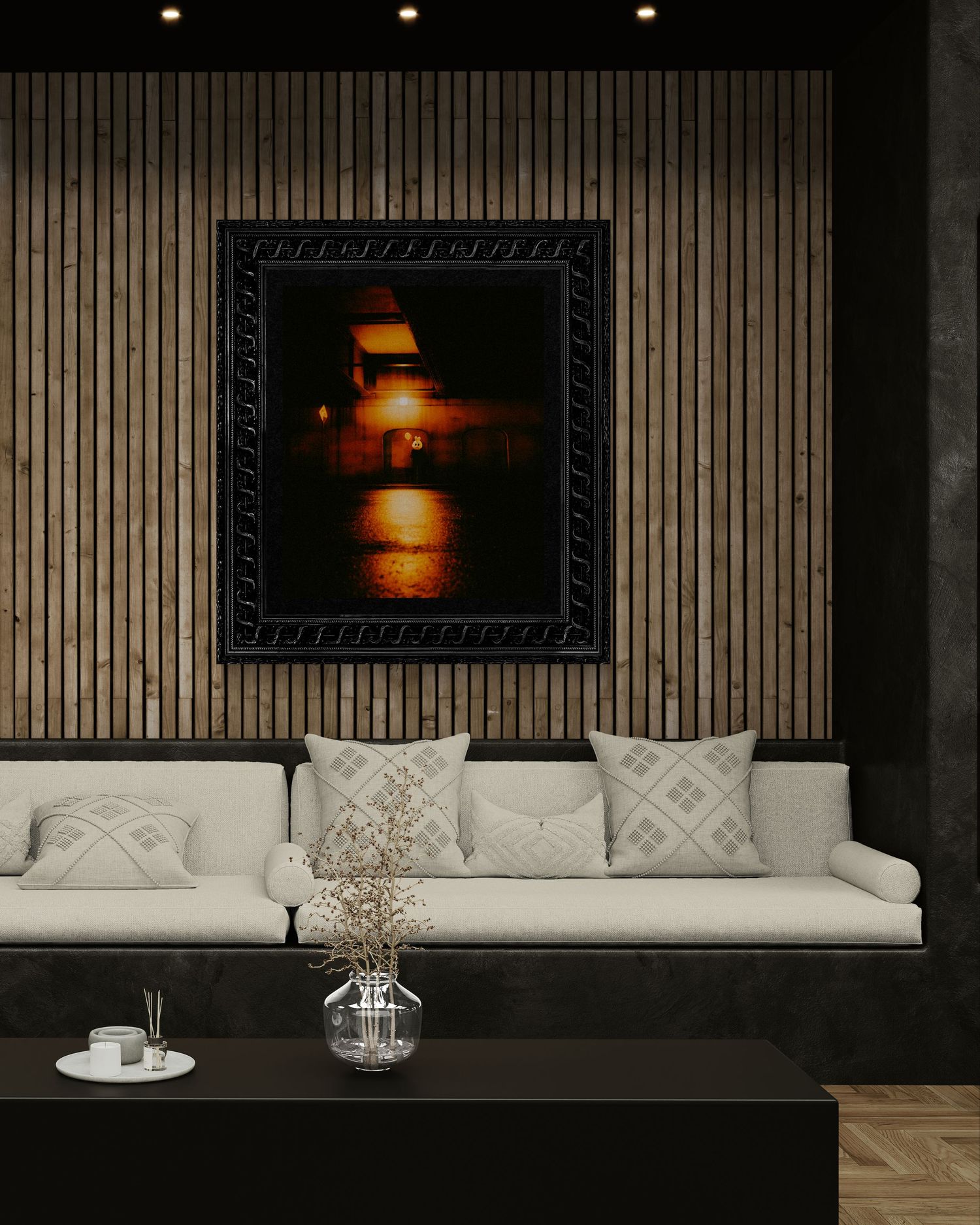 Dark moody framed artwork with warm amber tones displayed above a white sofa on a slatted wood accent wall.