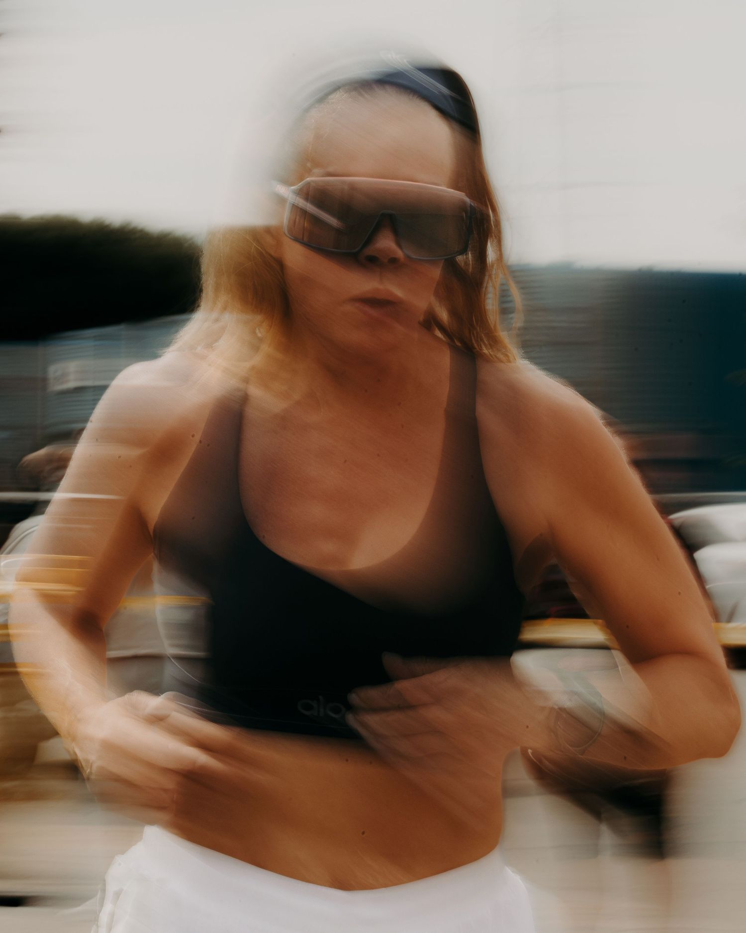 Dynamic motion blur photograph captures athletic movement in black and white tones.