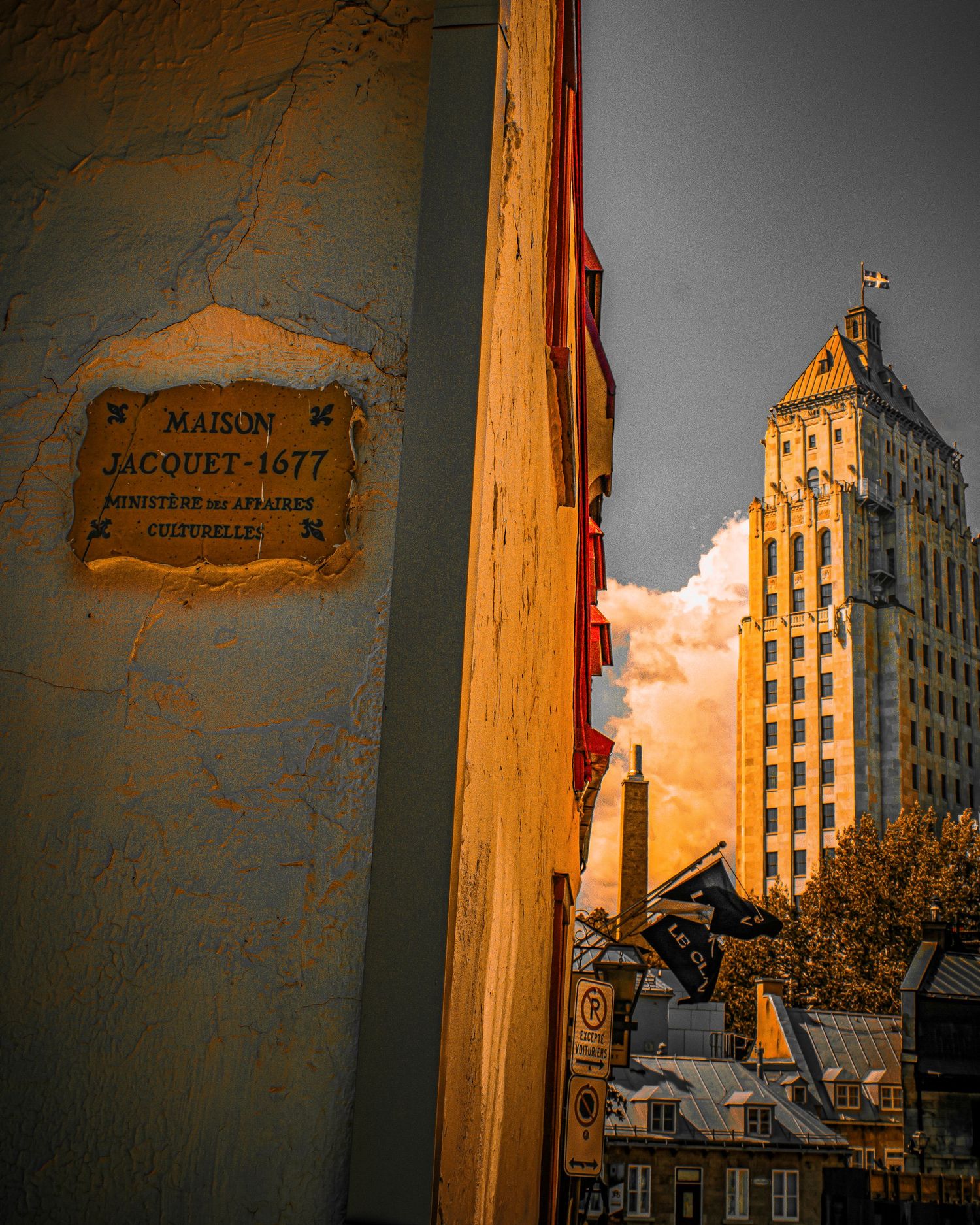 Vintage-toned urban architecture photo showing tall building against dramatic sky.