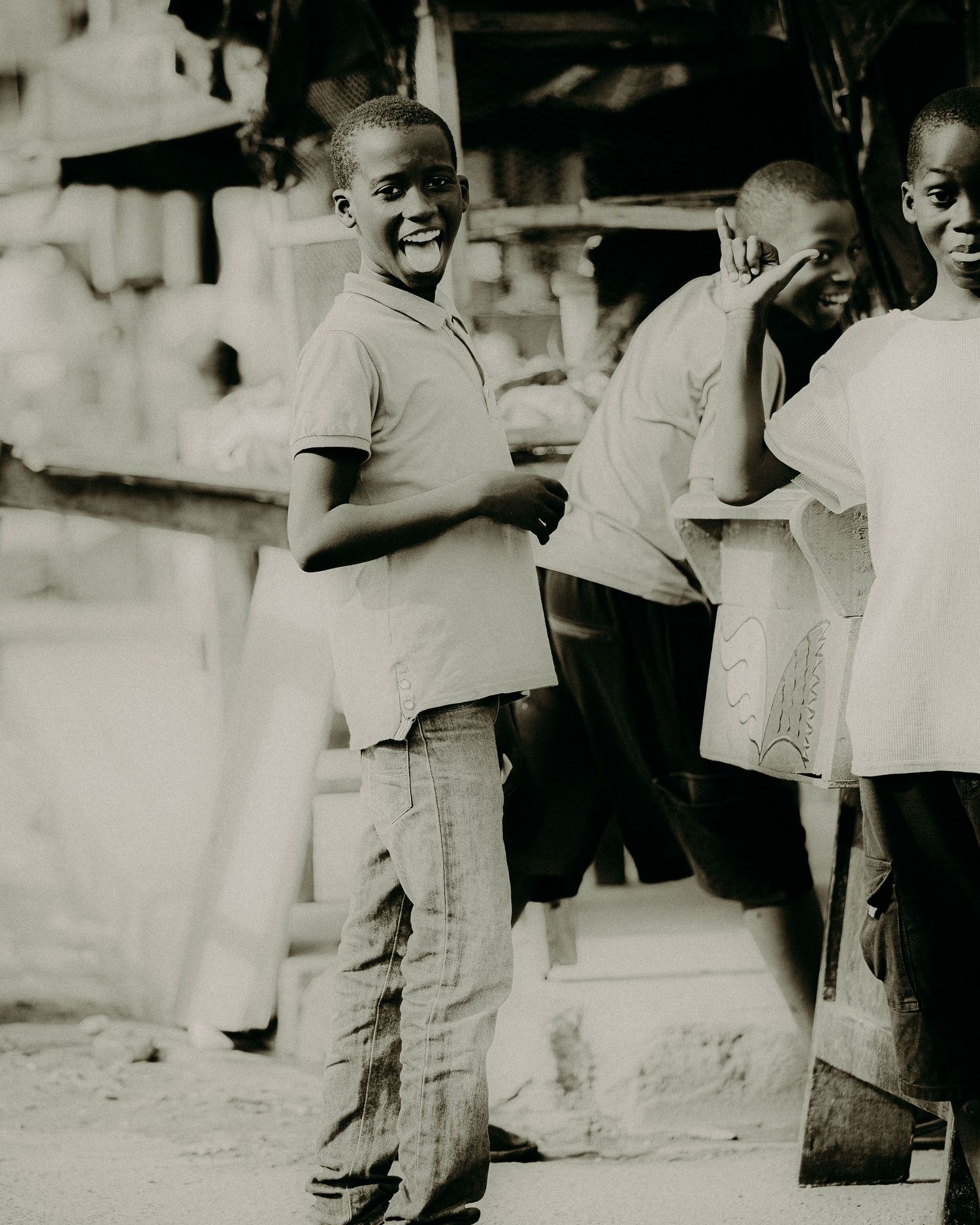 A series of vintage black and white photographs showing people smiling and interacting in a casual outdoor setting.