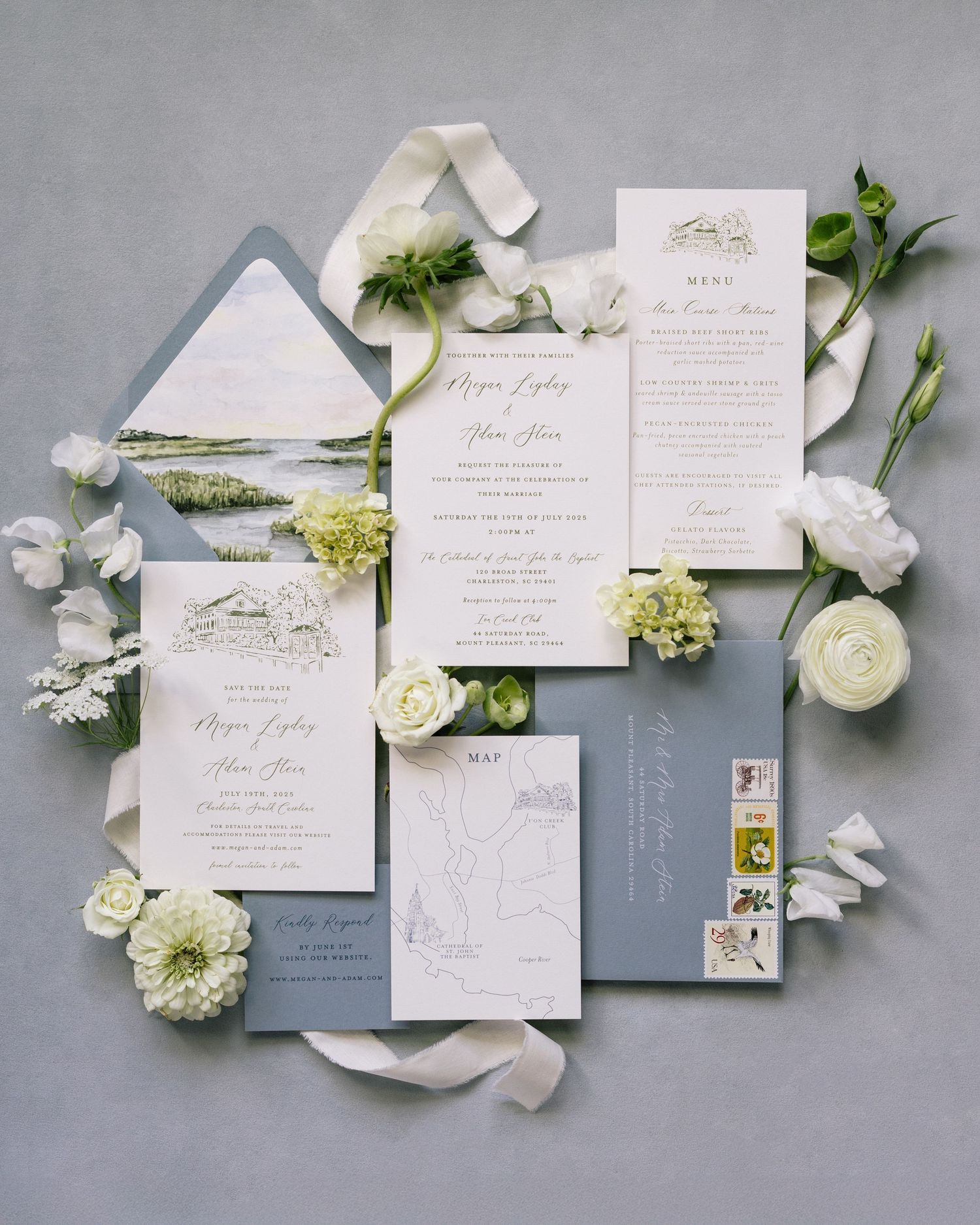 Elegant flat lay of wedding stationery including invitation, save-the-date, menu, and map styled with white flowers and soft blue accents.