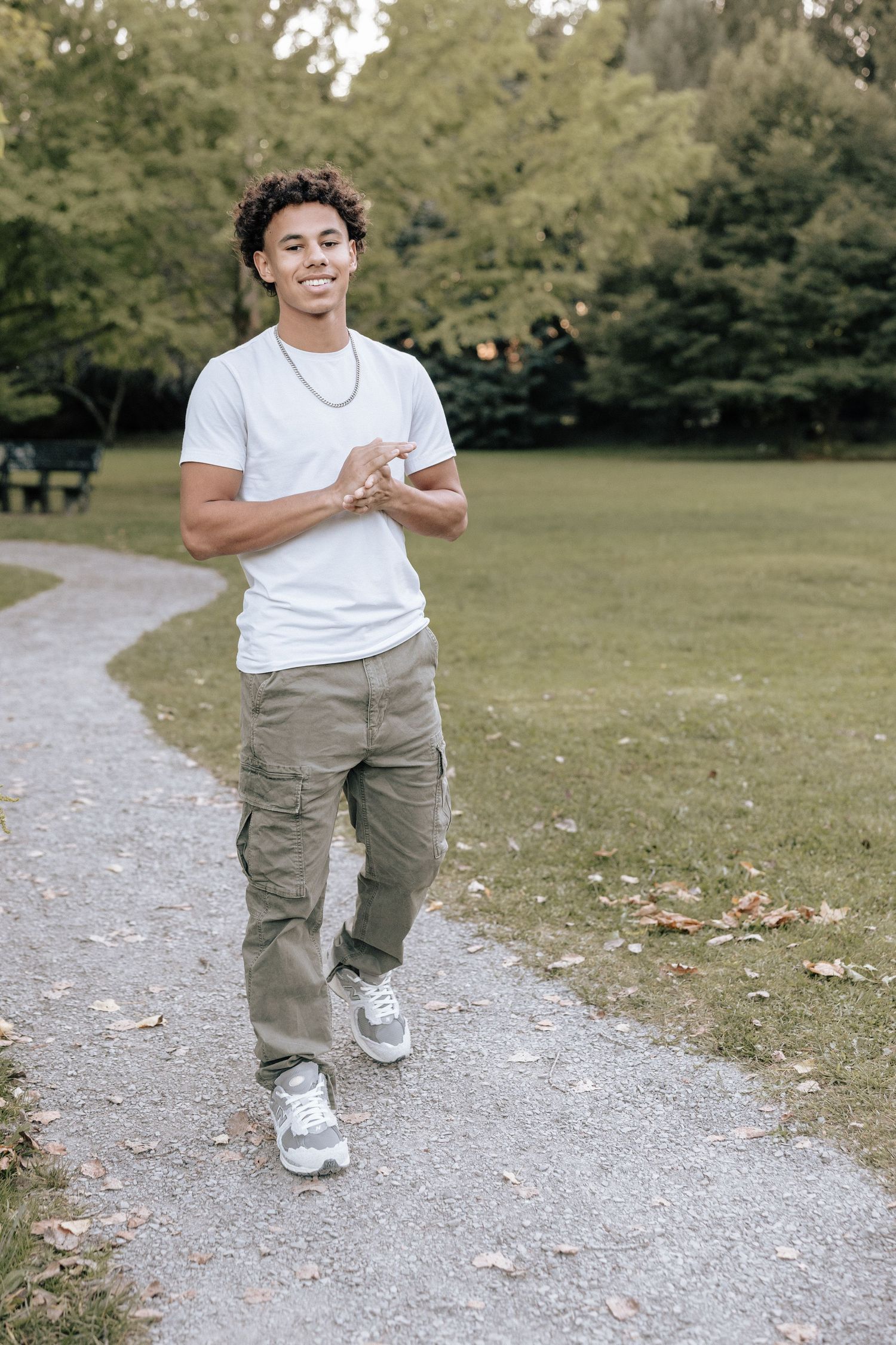 A series of four action shots showing someone running and playing on a gravel path in a park setting.