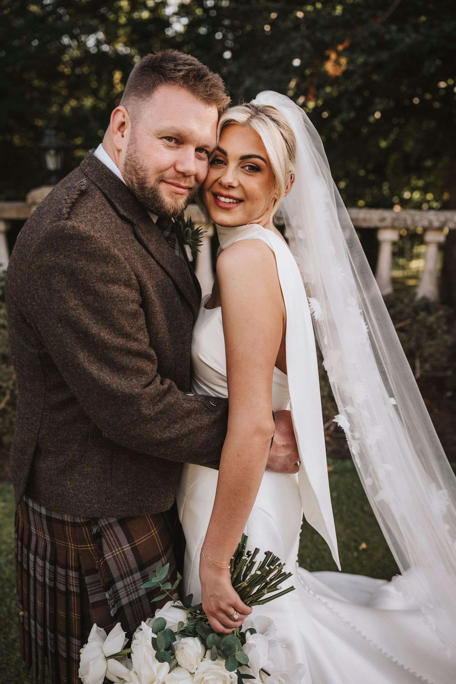 A romantic wedding photo sequence showing tender moments between newlyweds in traditional Scottish attire with a flowing veil.
