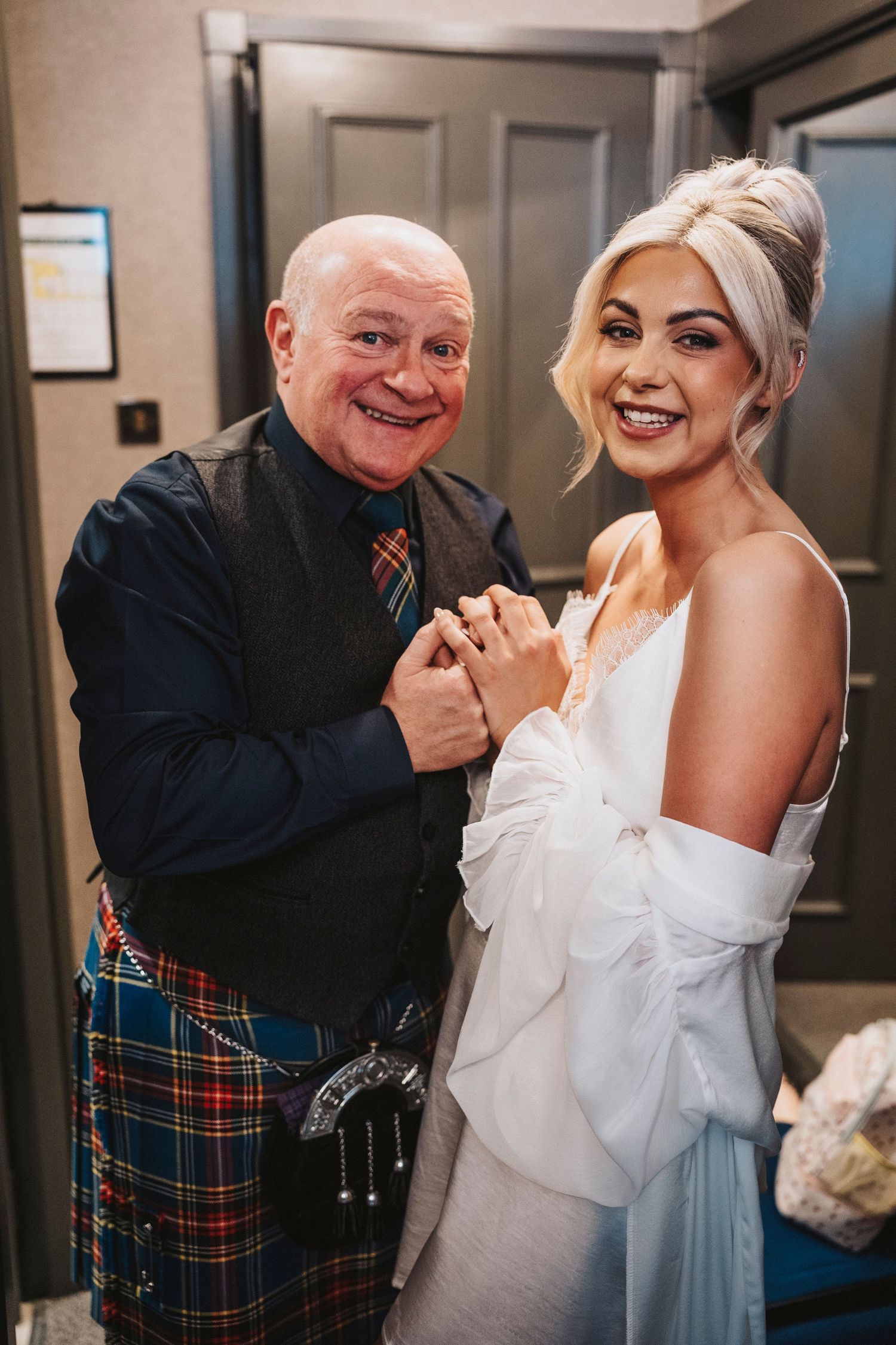 A heartwarming series of candid moments showing a bride and older gentleman in a plaid kilt sharing joyful dance moves.