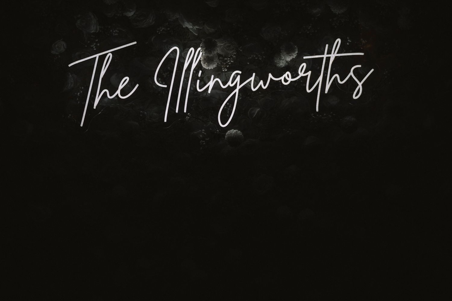Handwritten cursive text reading 'The Morgans' in white lettering against a black background.
