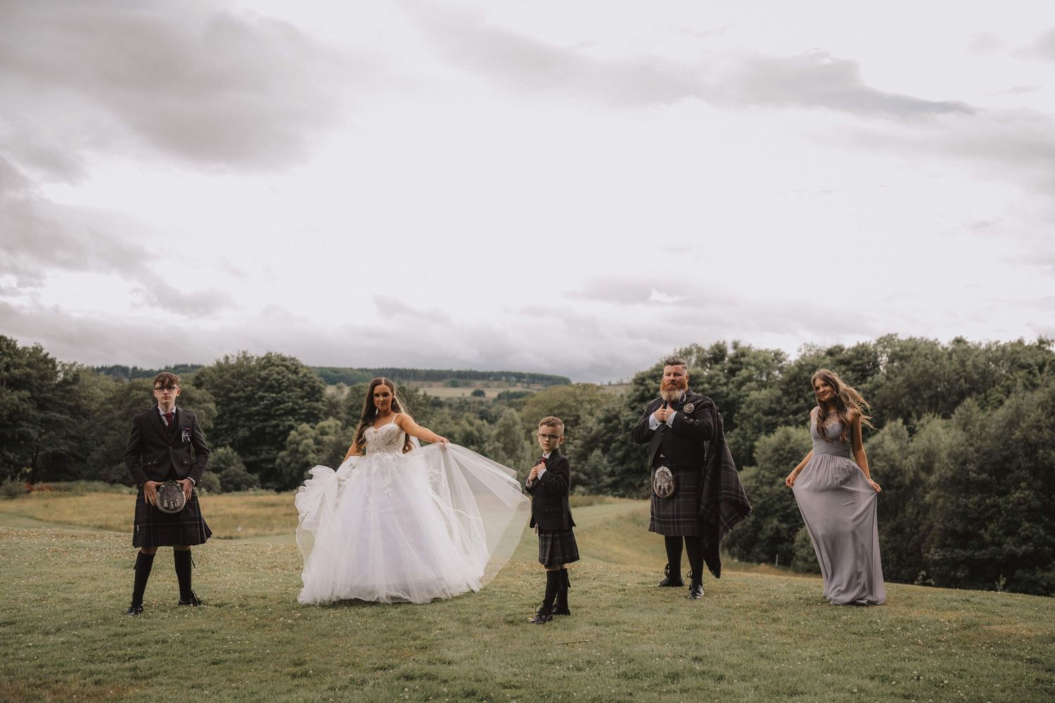 Panoramic wedding photo series showing couples in formal attire posing against scenic countryside and mountain backdrops.