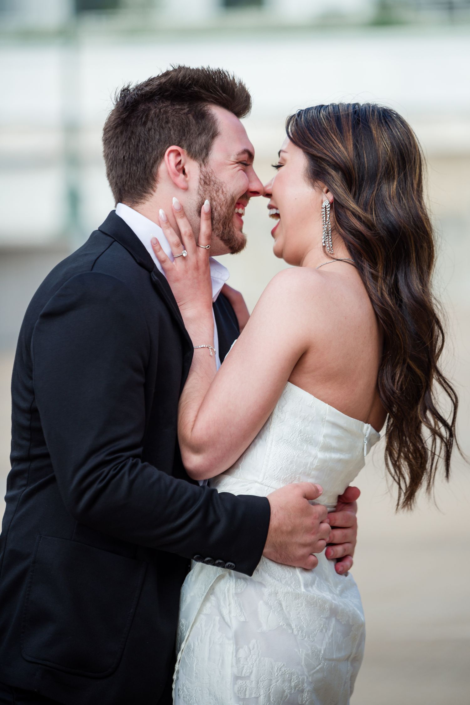 Couple sharing joyful laughter during intimate wedding portrait session by Stephanie Coulter Photography