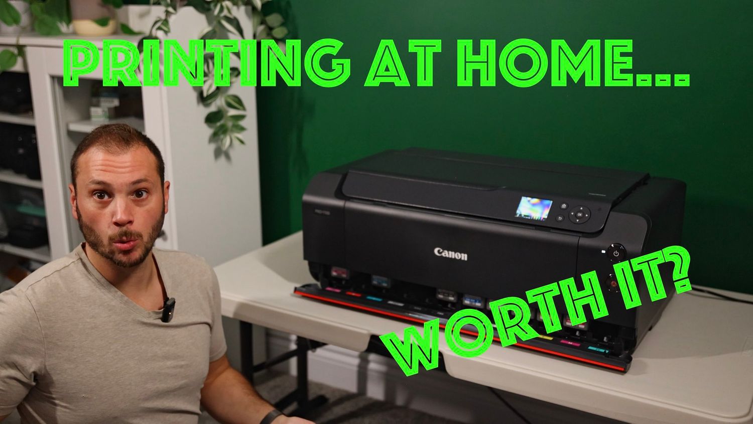 A printer sits on a desk with green text overlay asking if printing at home is worth it.