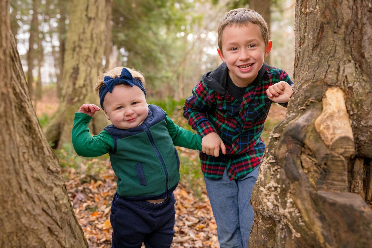 Candid moments of joy and laughter during a family photo session in the woods. Ottawa Family Photographer