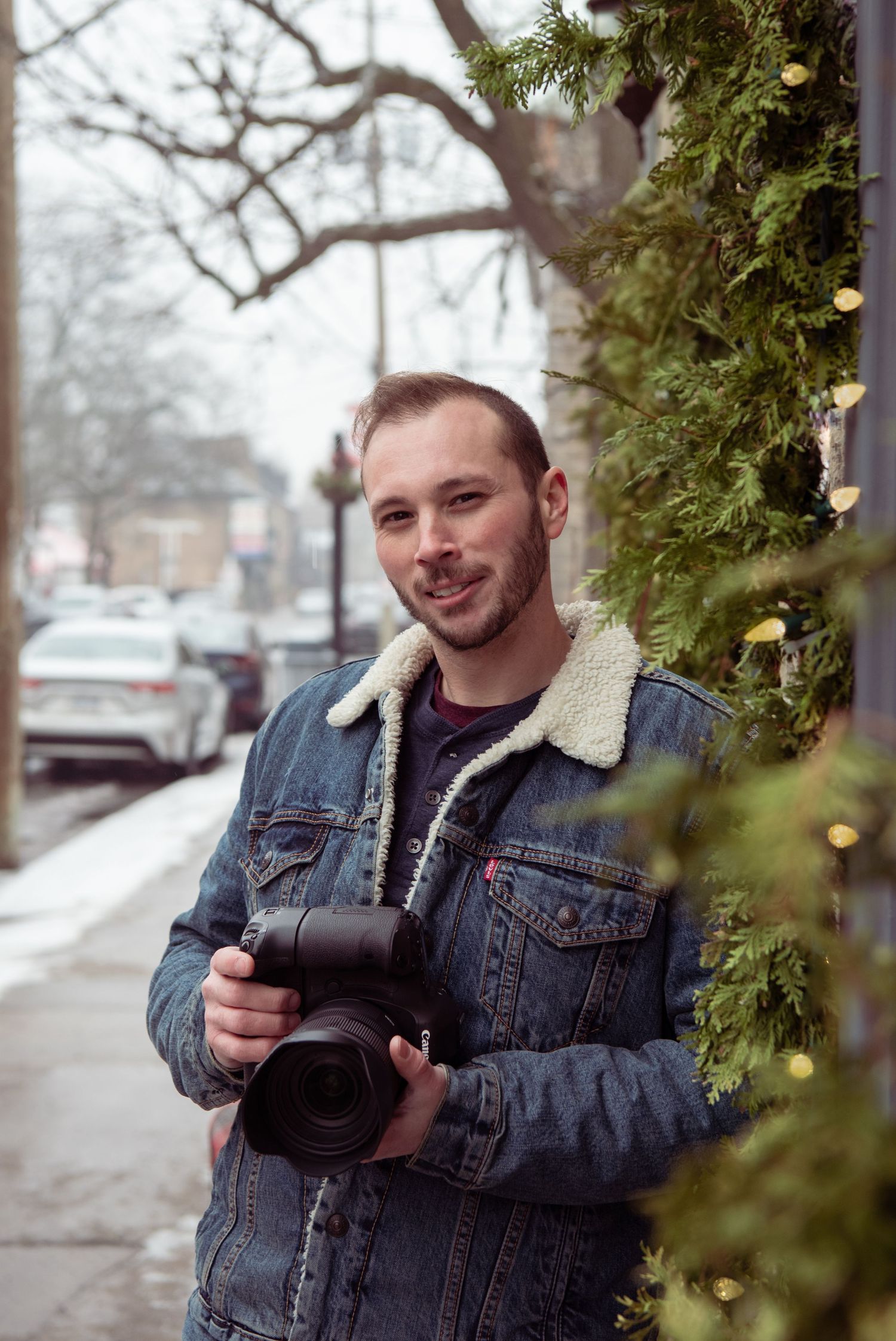 A Portrait of Tim Gowling Ottawa wedding & lifestyle photographer in a sherpa jacket.