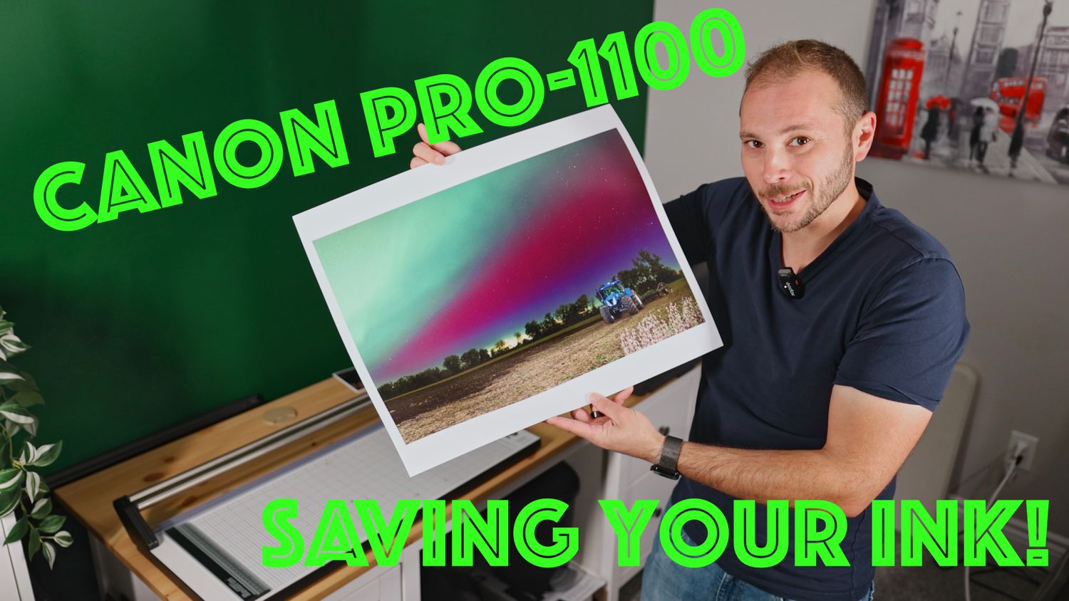 Man holding a large Canon PRO-1100 photo print demonstrating ink-saving tips for professional photo printing.