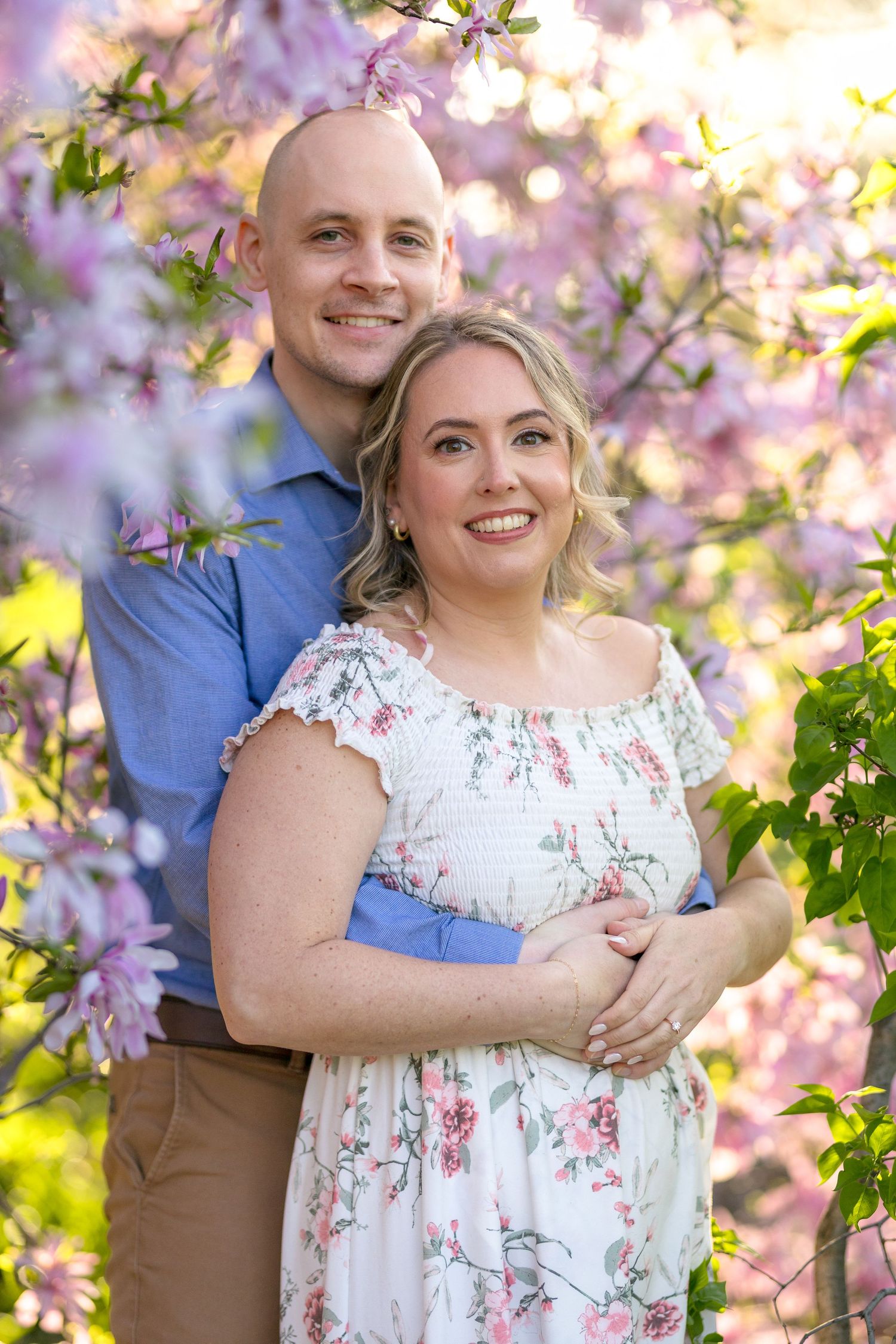 Romantic spring portrait with blooming cherry blossoms creating dreamy backdrop. Ottawa Wedding Photographer