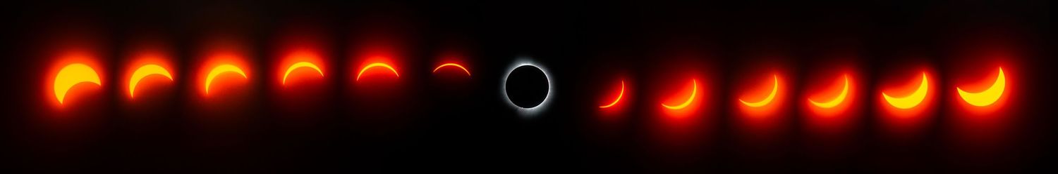 Time-lapse sequence showing phases of a solar eclipse against black sky.