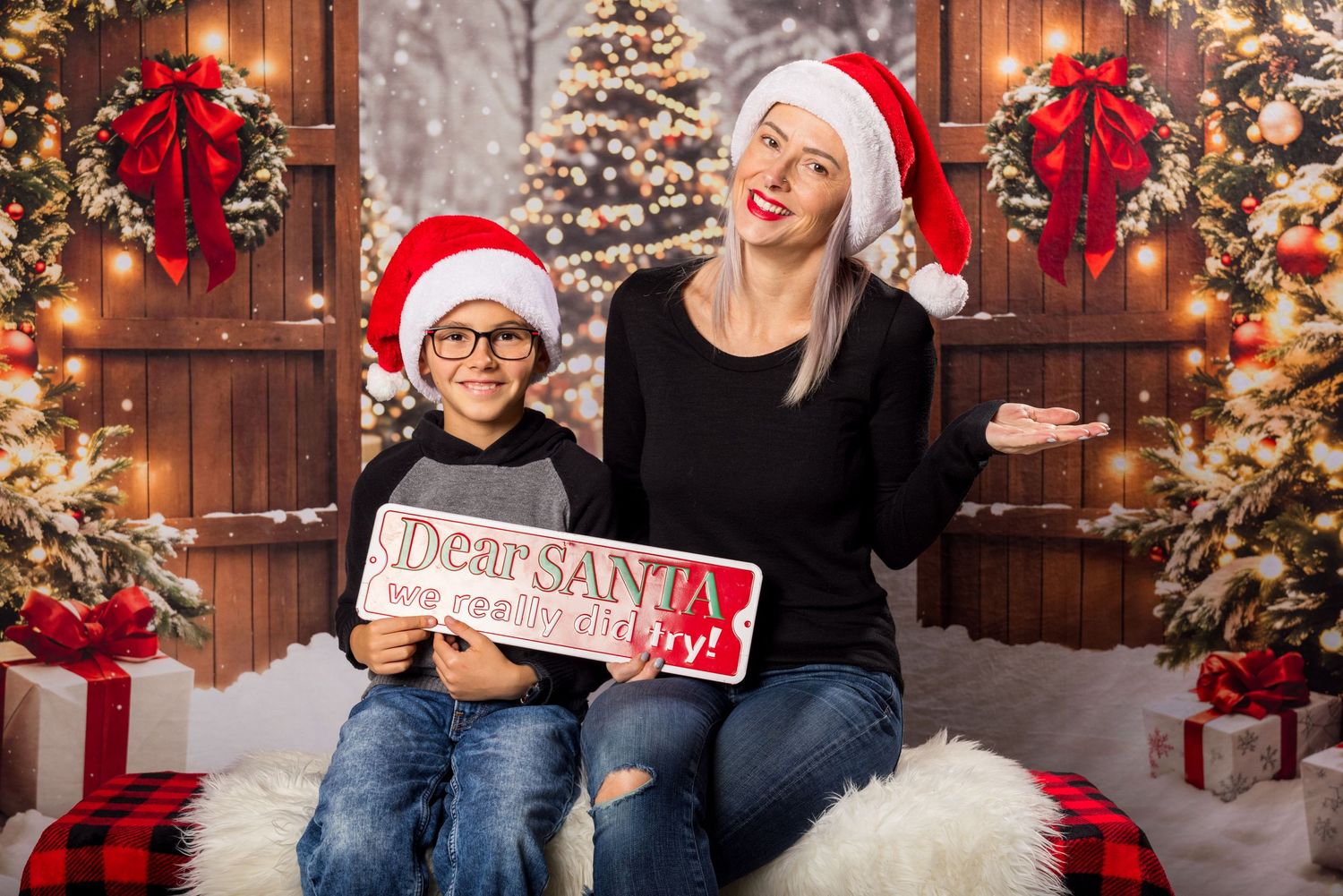 A festive Christmas scene with holiday decorations, a lit Christmas tree, red poinsettias, and a 'Dear Santa' sign.