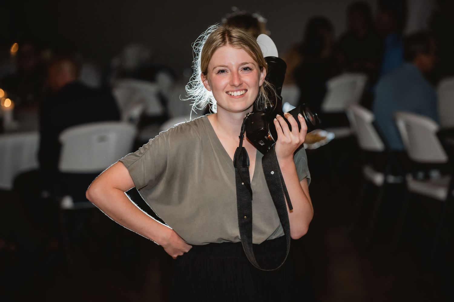 Sara holding a camera