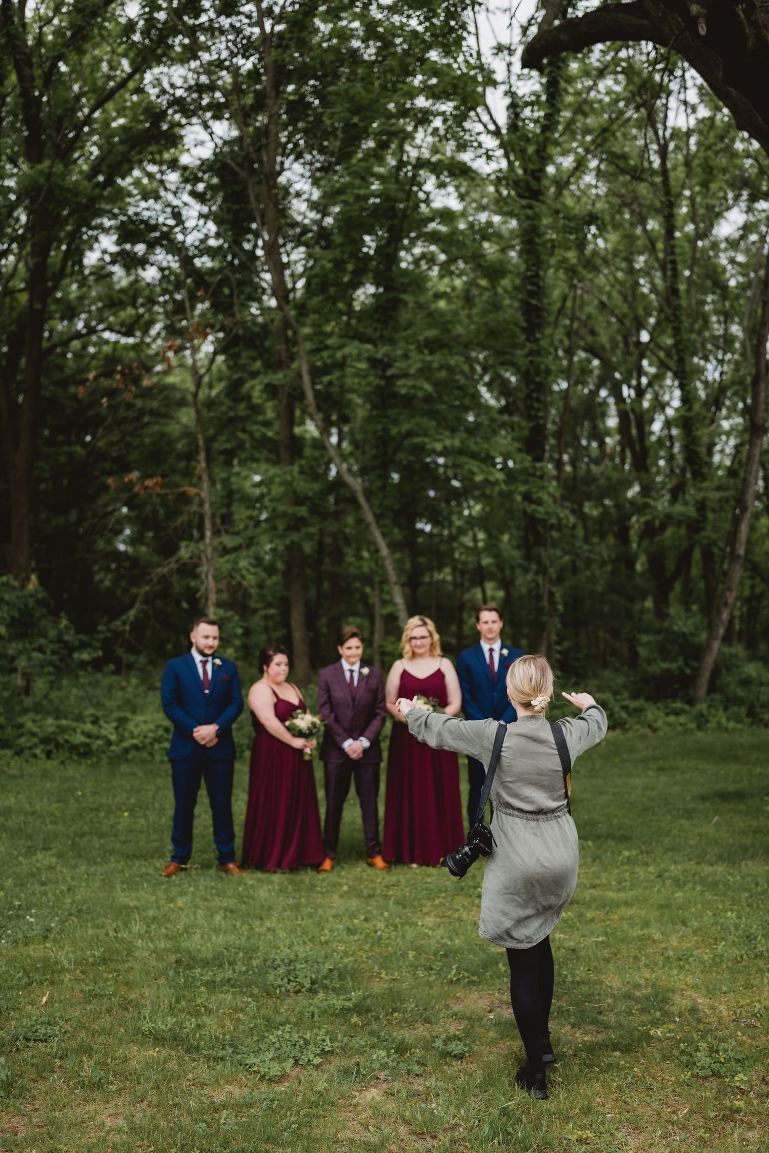 Sara directing a wedding party on how to pose