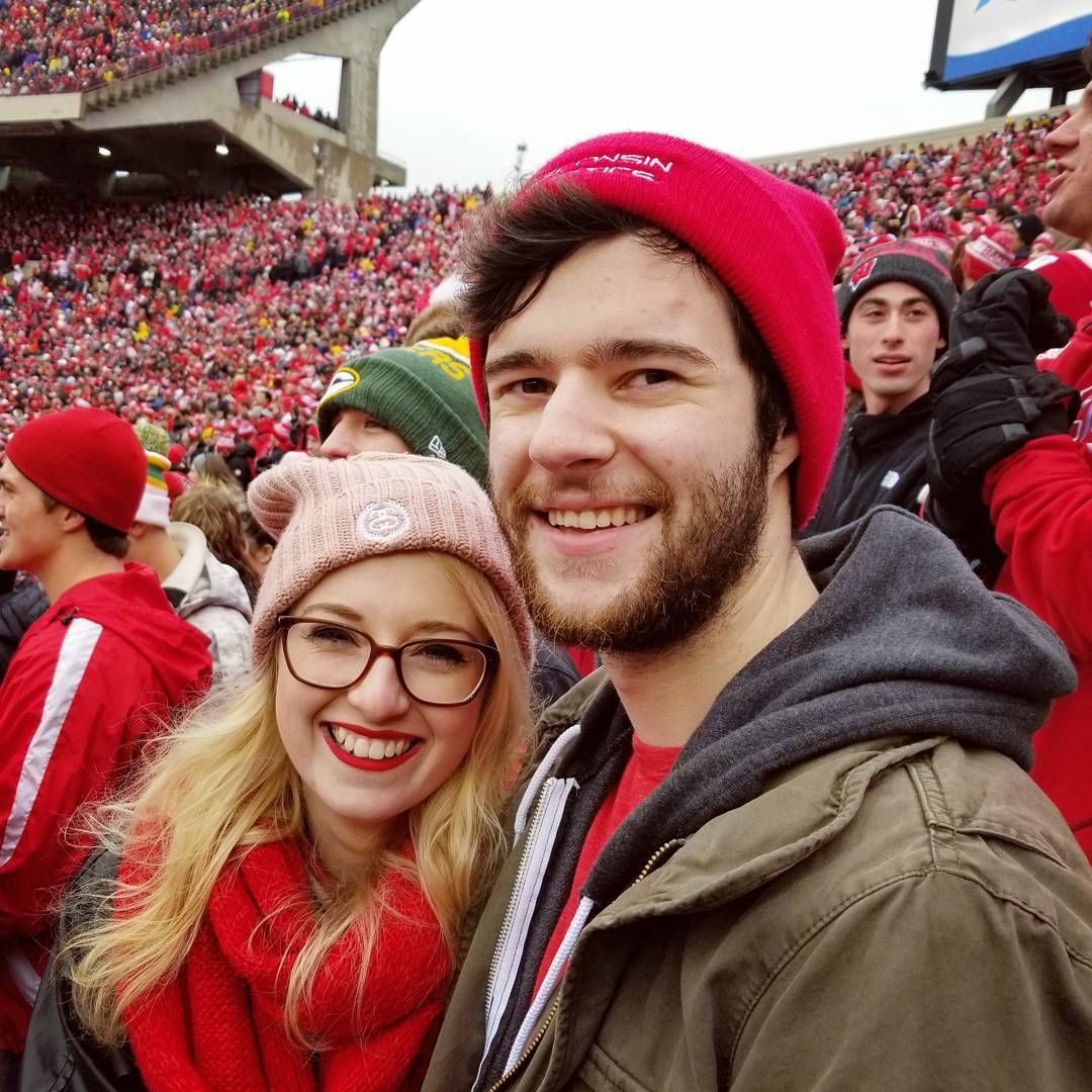 Sara and her partner at a Badger Football Game