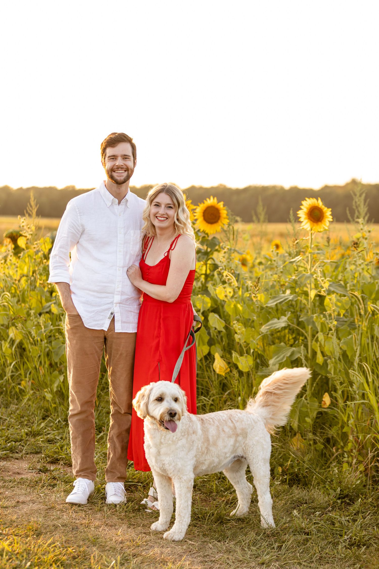 Sara's partner, Sara, and her dog, Phoebe posing for a formal portrait