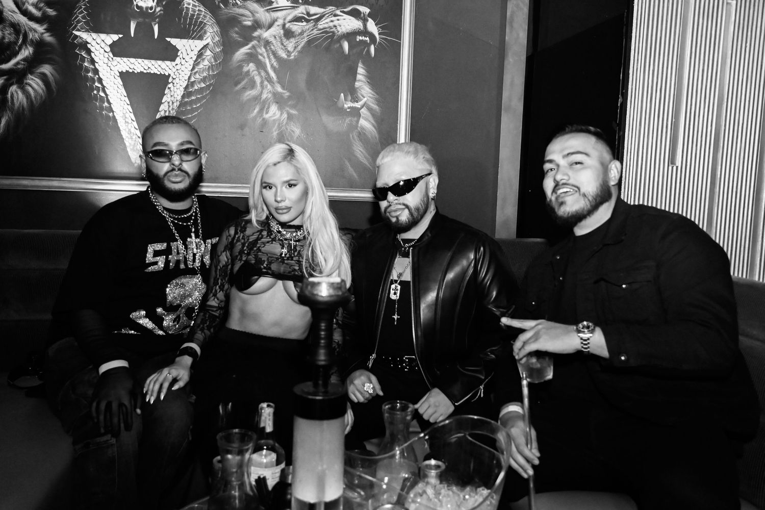 A group of people pose together in black and white photos showing a casual social gathering.
