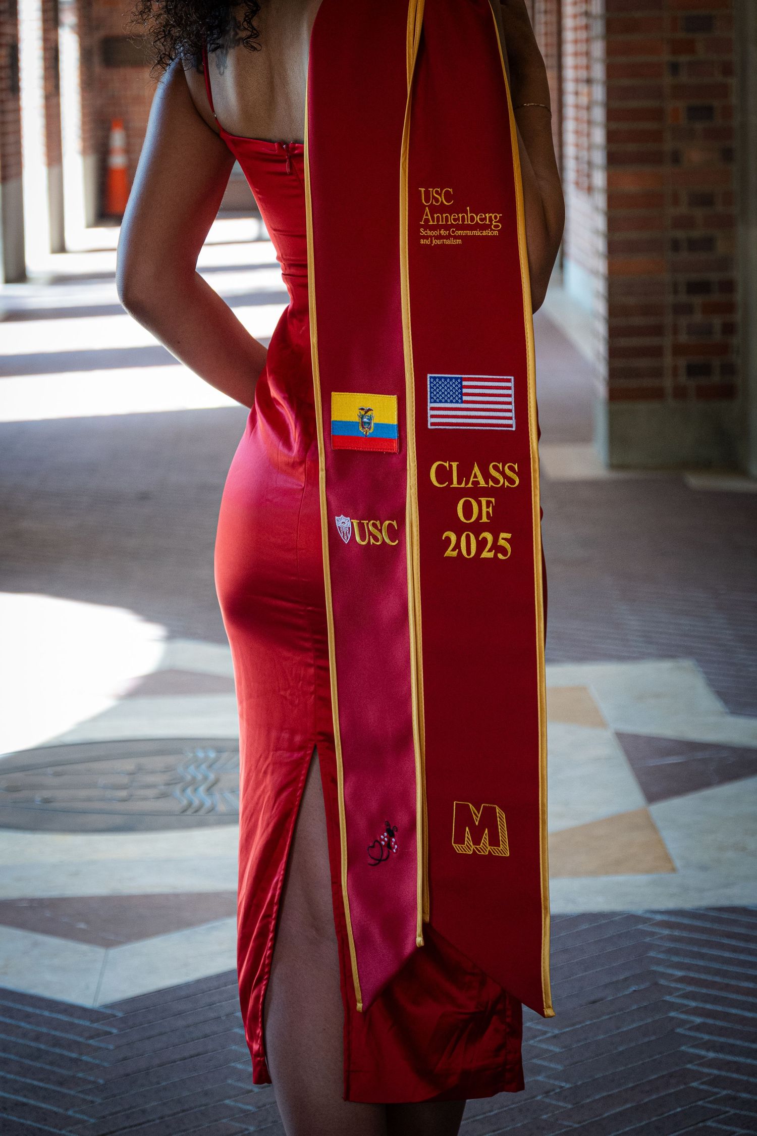 Close-up of graduation stole showing USC Class of 2025 with American and Ecuadorian flags.