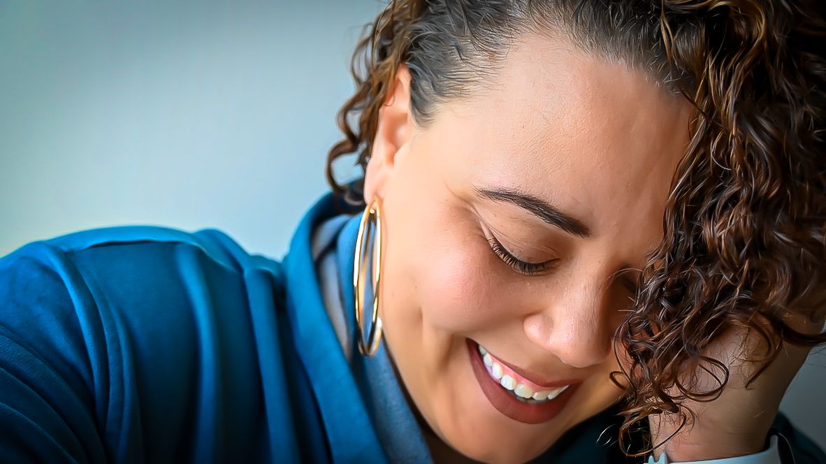 A close-up portrait showing warm smiles and natural expressions.