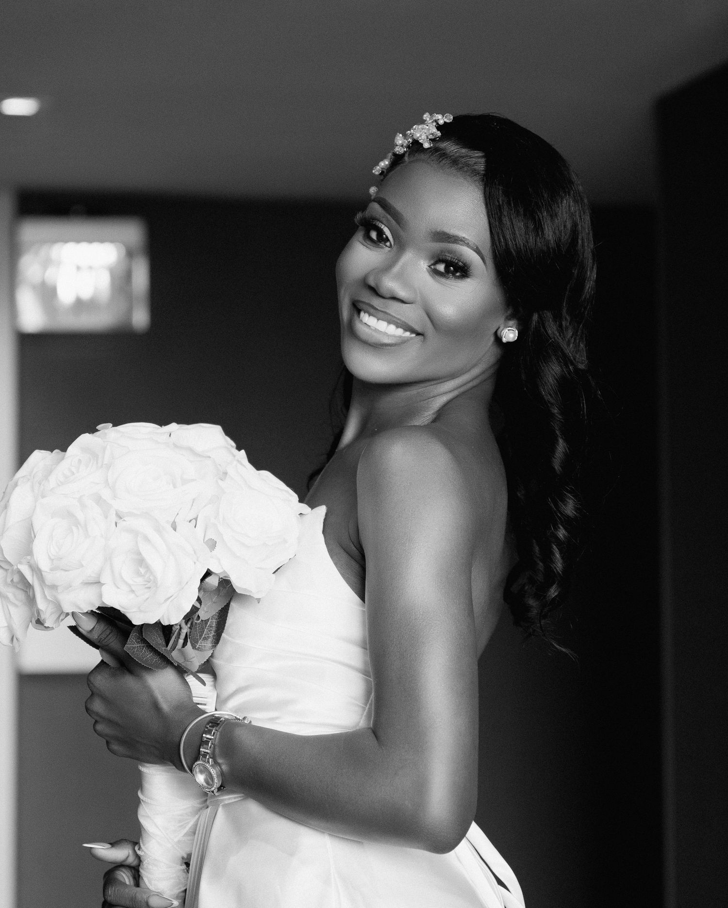 Artistic bridal photos showing details of a white wedding dress and rose bouquet.